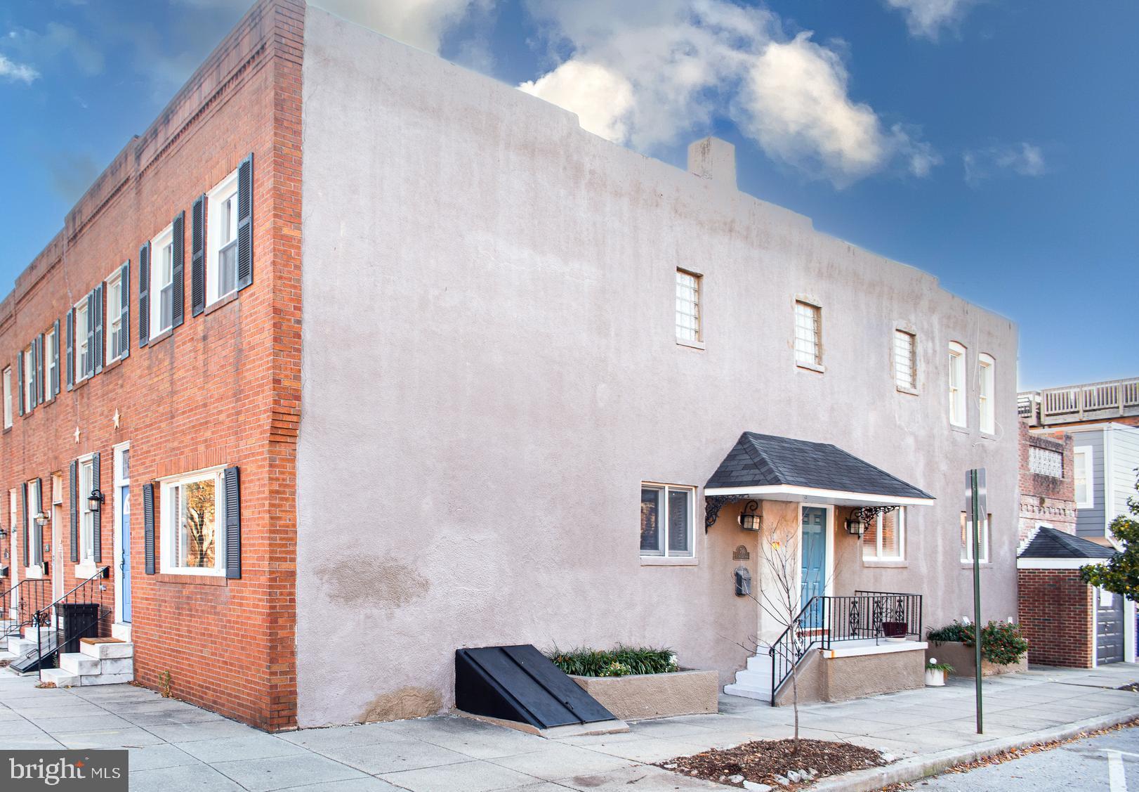 This spacious corner rowhome is in a fabulous location and has GARAGE parking! The walkability for this property is outstanding. Beautiful Patterson Park, the Canton waterfront, O'Donnell Square Park, and the Highlandtown Arts and Entertainment District are all nearby. Restaurants, shopping and public transportation are only minutes away. It is centrally located to explore other areas of the city, and close to I-95 / I-895 / I-83. Since this home is an end unit, there are many windows to let in lovely natural light and a covered entry porch on the side. The garage is on the rear of the home, includes an automatic opener, has the potential for overhead storage, and has easy entry from Foster Avenue. On the interior, there are hardwood floors, tray ceilings and recessed lighting. Through the new entry door, the main level has an inviting open layout with an expansive kitchen, dining room, and living room. The upper level has a primary suite which has new windows, includes two closets (one walk-in) and an attached bath. The primary bath has a large separate shower and jacuzzi tub. The second bedroom has a skylight and access to a private balcony. The second bath with a tub/shower, and the linen closet are off the upstairs hallway. The basement is mostly finished for additional living space, has plentiful storage, and there is an adjacent combination laundry/half bath. Quick settlement/possession. Schedule a tour today!