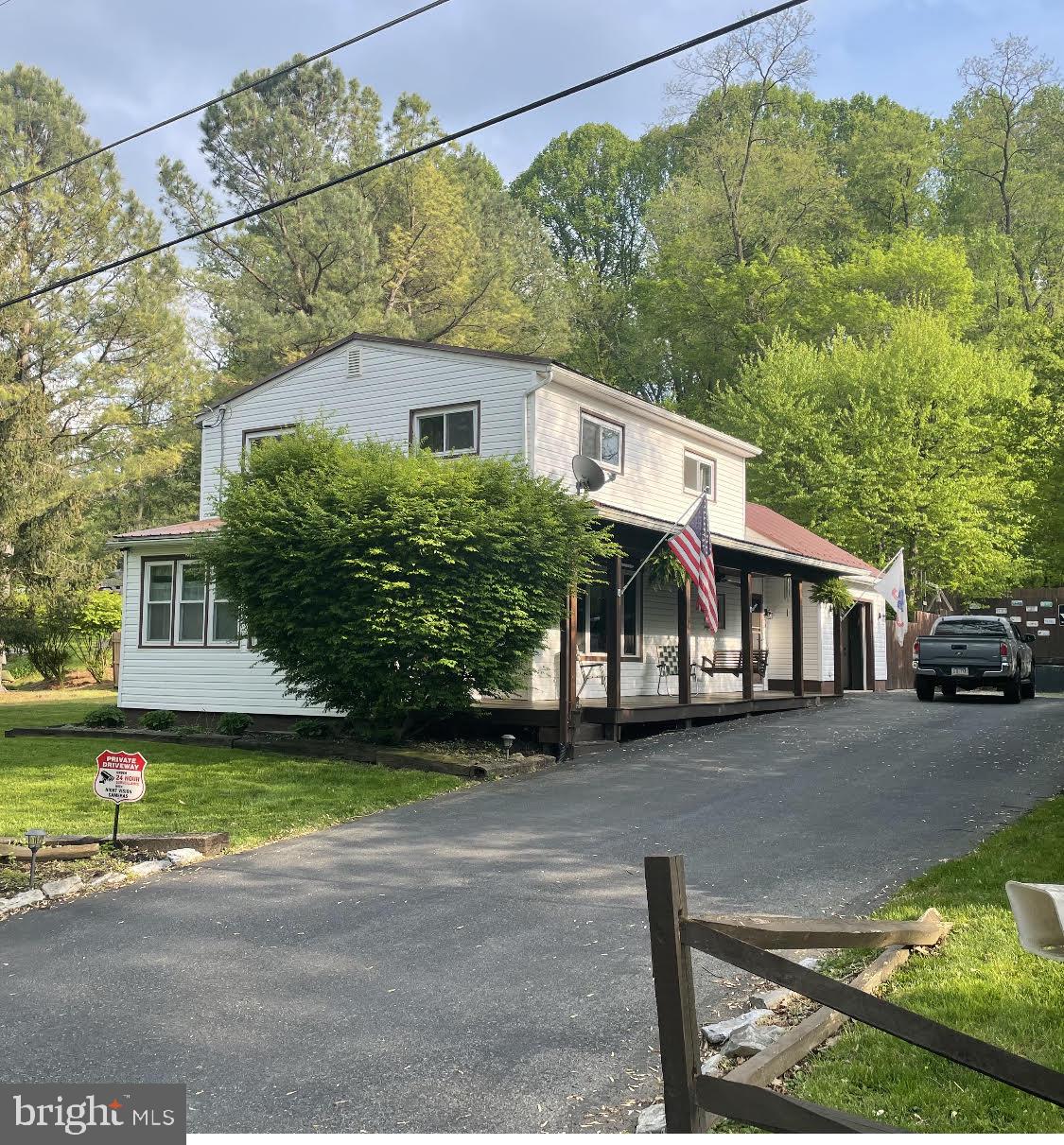 This home is located on a private lane in Conestoga and offers a peaceful country oasis. It features three bedrooms and two full baths, as well as a wraparound porch. The backyard is an oasis with an above ground pool, a six-foot privacy fence, a large shed, and extensive landscaping. This space is perfect for both relaxation and entertaining.
This home is move-in ready with a new heat ventilation air conditioning system installed on 3/22 and a security system installed on 1/22
For dog lovers, this home offers two built-in kennels and a grooming area in the lower level. These amenities make it a dream for pet owners who want to keep their furry friends happy and healthy.