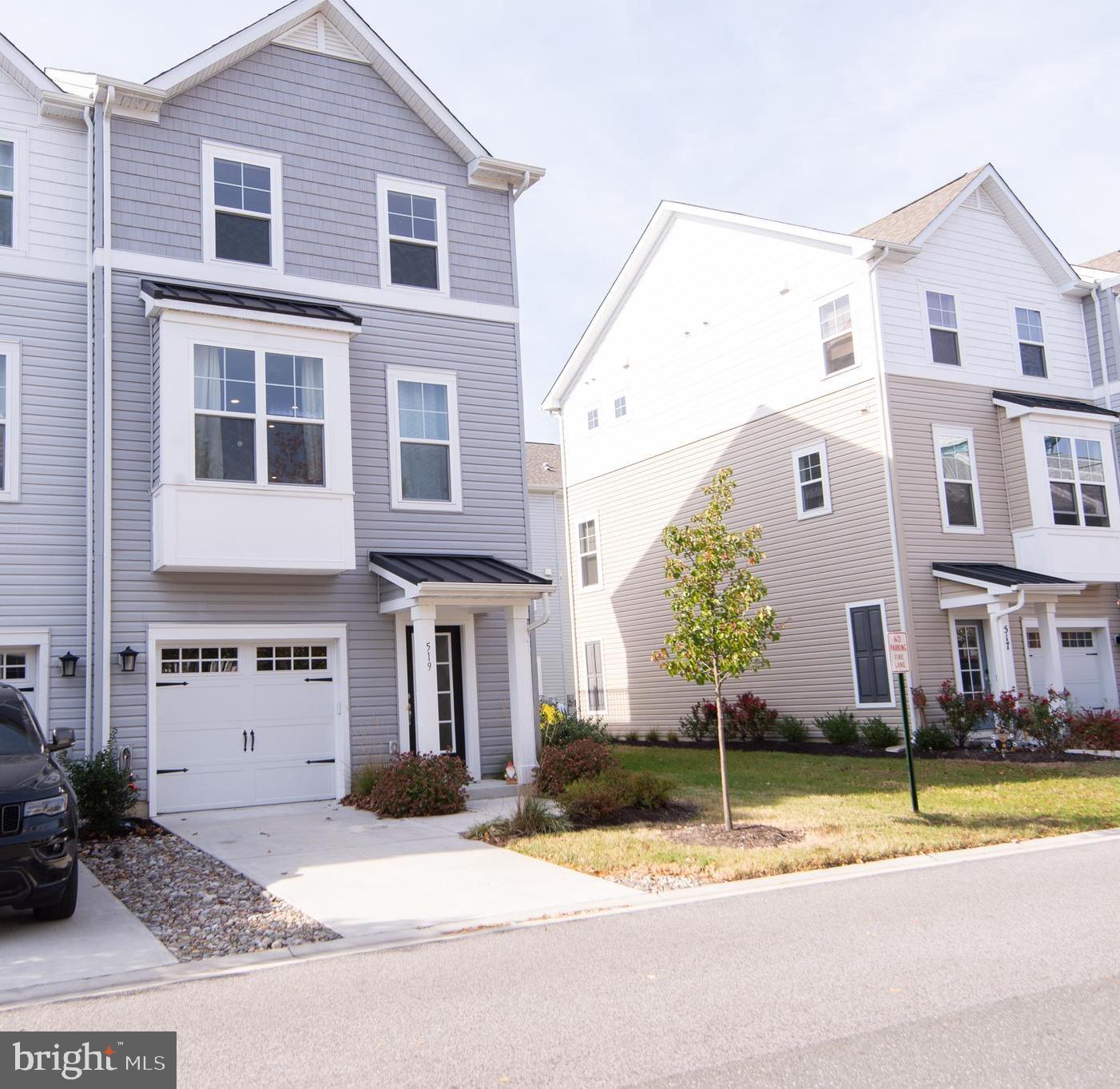 Lovely End Unit in Deep Harbor! This like-new, 3-level townhome delivers incredible value, water views, and a long list of upgraded finishes throughout — including enhanced flooring, additional recessed lighting, high-end fixtures, composite decking, and upgraded kitchen + bath selections that elevate both style and function. Thoughtfully designed -the entry level features a welcoming foyer and versatile den—ideal as a home office, lounge, fitness space, or playroom—plus interior access to the attached garage. The main living level showcases an exceptional kitchen with abundant cabinetry, beautiful backsplash, recessed lighting, stainless steel appliances, large center island, and plenty of prep + storage space. Enjoy connection to the outdoors with two composite decks overlooking Cambridge Creek & Generation III Marina—perfect for morning coffee, sunset watching, or entertaining. The top floor features a lovely primary  suite with tray ceiling detail, walk-in closet, private deck, dual vanities, and an oversized walk-in shower. Two additional bedrooms share a beautifully appointed hall bath. A great perk is the full-size stack washer & dryer which are conveniently located on the bedroom level. Deep Harbor amenities include: gated entrance, waterside walking paths, community pool, and marina access—and are all within walking distance to downtown Cambridge dining, shops, events, and waterfront recreation. **The unit is located in an area of Deep Harbor where short term rental like Air BNB, VRBO, etc. are permitted- making this a great investment opportunity as well! ** Boat slips are available on a first come first serve basis within the Deep Harbor Community OR utilize slip leases at: City of Cambridge's  Municipal Yacht Basin, Dorchester Co., Generation III Marina, and Cambridge Yacht Club. Don’t miss this exceptional opportunity to secure a modern, low-maintenance home on the Eastern Shore!