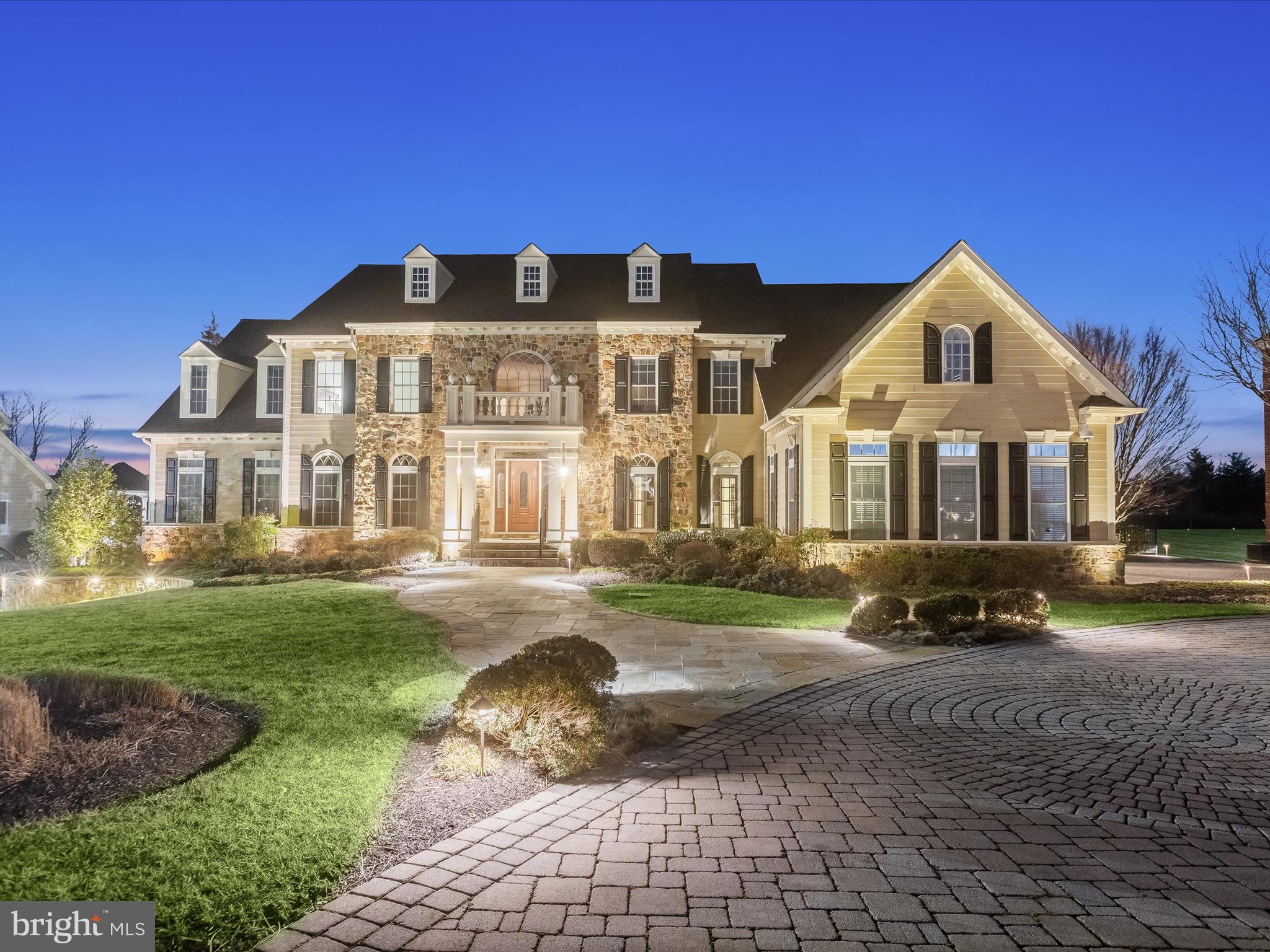 Sited on nearly nine acres in the heart of Clarksville, with acquired Preserve land, this property is one of a kind and a very rare opportunity.  Built by NV Homes, this Monticello has options and amenities at every turn.  Inside, a two-story foyer is defined by a pair of curved staircases that cascade around the marble floor, medallion and tray ceiling. The foyer is sided by living and dining formals and the extended foyer is defined by four classical columns that announce arrival into the heart of the home. On an axis with the foyer, a wall of windows and transoms stream light into a spacious Family Room where family and friends can gather under a dramatic coffered ceiling to enjoy the fireplace and media built-ins. 

The thoughtful floor plan circles from the Family Room around a private secondary stair to the Kitchen and Breakfast Room with atrium doors leading to an outdoor covered pavilion, dining deck and gazebo. The gourmet kitchen has a commanding center island, Viking appliances, and a sizable walk-in pantry outfitted with an elaborate organizer system.   The morning room in the round is bathed in the light from windows on three sides and has a breakfast bar with an observation opening into the kitchen, while the breakfast room shares a planning hutch and a butler’s service pantry.  The main level extends to include a study with built-in library shelving and a quintessential Monticello conservatory on one wing, and an oversized laundry center, planning desk, arrival center with built in cubbies, garage access door and a secondary entrance door near the exterior electric car charging station and extra car park area. 

Upstairs, six en-suite bedrooms and five full baths encircle the open upper landing and terminate at the primary suite that is announced with French doors that open first into a gracious sitting room with lighted built-ins and a beverage fridge. The primary bedroom follows form with a dramatic tray ceiling with cove lighting, and a second built-in wall of millwork for mounted media, book shelving, and cabinetry storage. Downstairs, a full daylight basement is above grade in the rear of the home and offers robust indoor entertainment venues including a wet bar, full back bar with dishwasher and beverage fridge, billiards area, game area, recreation, ensuite bedroom, exercise room and theater riser and race car simulator.  

Outside, a professional Landscape Architect created a resort-like setting with outdoor living, dining and entertaining spaces and a spectacular lighting design.  The design plan begins on the paver driveway and the meandering front walk, to the stone garden beds that wrap the foundation plantings. The lower level continues the design with an expansive stone patio, bordered by pavers and plantings that follow the overall form and design. A covered patio protects an outdoor kitchen and bar, while an outdoor fireplace is artfully enhanced with a pergola.  The upper covered deck is richly crafted with Epi wood that extends in two directions to include a sitting area on one side and a gazebo on the other side.  Lovers of outdoor living will thrive in this setting, where they can enjoy endless options for living, dining and entertaining including music from outdoor speakers, dramatic landscape lighting for starry nights, and heaters to extend the season.  Come home and embrace every moment of a very special lifestyle with nearly 10,000 square feet of living space, overlooking nearly nine acres of Preserved land right in your backyard.