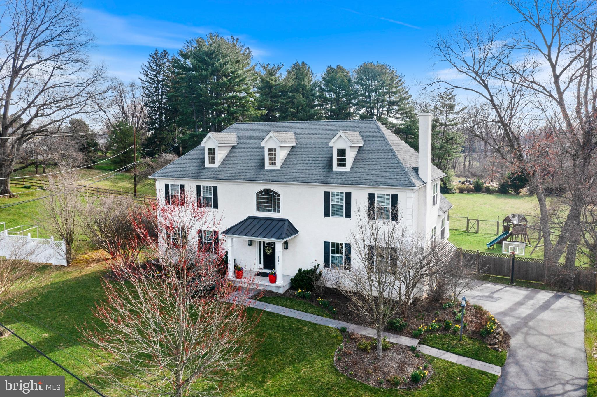 Don’t miss this expansive 4-5 BD, 4/1 BA French Colonial home in Newtown Square! Extensively renovated and expanded in 2015, this spacious yet comfortable home is set on a beautiful 1.20 ac. property with sweeping scenic views. Features include neutral paint tones, custom millwork, abundant recessed lighting, gleaming site-finished wood floors and HardieBoard siding on the sides and rear elevations.. A flagstone path leads to the front porch and soaring 2-story Entrance Hall, which is open to the Living Room. A formal Dining Room is located off the gourmet Kitchen, which has neutral cream cabinets, granite counters, and stainless appliances, including a 5-burner gas cooktop with overhead exhaust hood. The large center island has breakfast bar seating. The open concept floor plan has great flow to the large Breakfast Room and vaulted Family Room with gas fireplace. This sun-drenched space has large windows and sliding glass doors to the easy-maintenance, composite rear deck. The flexible floor plan also features a 1st floor Office/Study and a 4th full BA, making this space ideal for use as a 5th Bedroom suite.  Upstairs is a private Primary Bedroom suite with two walk-in closets and a spa-like Bathroom with double vanity, jetted tub, large shower with frameless glass enclosure, and private water closet. Bedroom 2 is adjacent to a 2nd Full Bathroom. Bedrooms 3 and 4 share the Jack n’ Jill Full Bathroom # 3. The 2nd floor Laundry Room also has pull-down stairs to the Attic. The Lower Level of this home features a large walk-out Recreation Room with ample space for TV watching, game table, and exercise equipment. There is also a lower level Powder Room. A well-organized Mudroom with extensive cubbies is located near the entrance to the 2-car attached Garage and Utility/Storage Room. The expansive rear yard features a fenced-in area for children and pets, plus additional land beyond the fencing. Gardeners will love the small orchard area and raised vegetable beds. Convenient location, close to shopping, restaurants, the Blue Route, private golf clubs, Culbertson Elementary School and EA. Easy access to Center City and the Airport.  LOW taxes too!