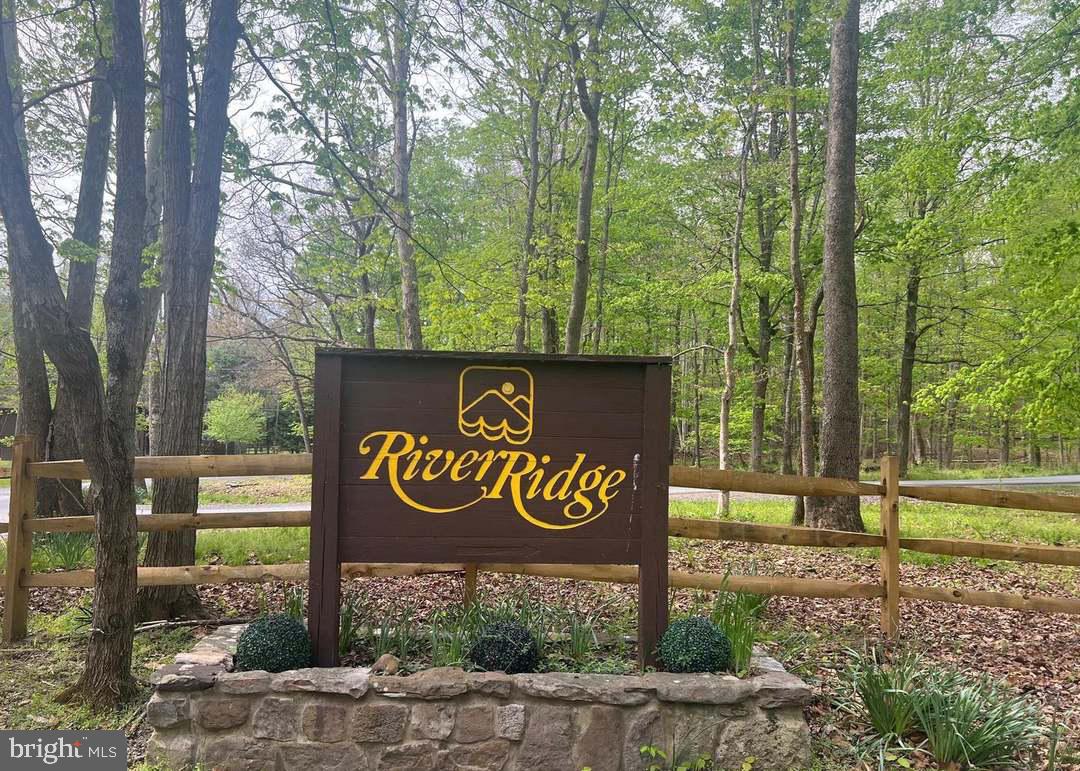 Lots 64 & 65 in the River Ridge subdivision offer 12.42 wooded acres with plenty of privacy and room to spread out. Located approximately 2 hours from Washington, DC, River Ridge offers a peaceful mountain setting with private Cacapon River access while remaining an easy weekend getaway from the city. Whether you're planning to build a full-time home, weekend cabin, or simply want a place to get away, this property is worth a look. The land is mostly wooded and flat with rolling hills in spots, with several potential building sites and is located in a gated community. 

Owners in River Ridge enjoy access to a private Cacapon River common area, making it easy to spend time fishing, kayaking, swimming, or relaxing by the water. Conveniently located just a short drive from Berkeley Springs, you'll have easy access to local shops, restaurants, and amenities while still enjoying the peace and quiet of the mountains.

Come walk the property and see what this beautiful piece of West Virginia has to offer.