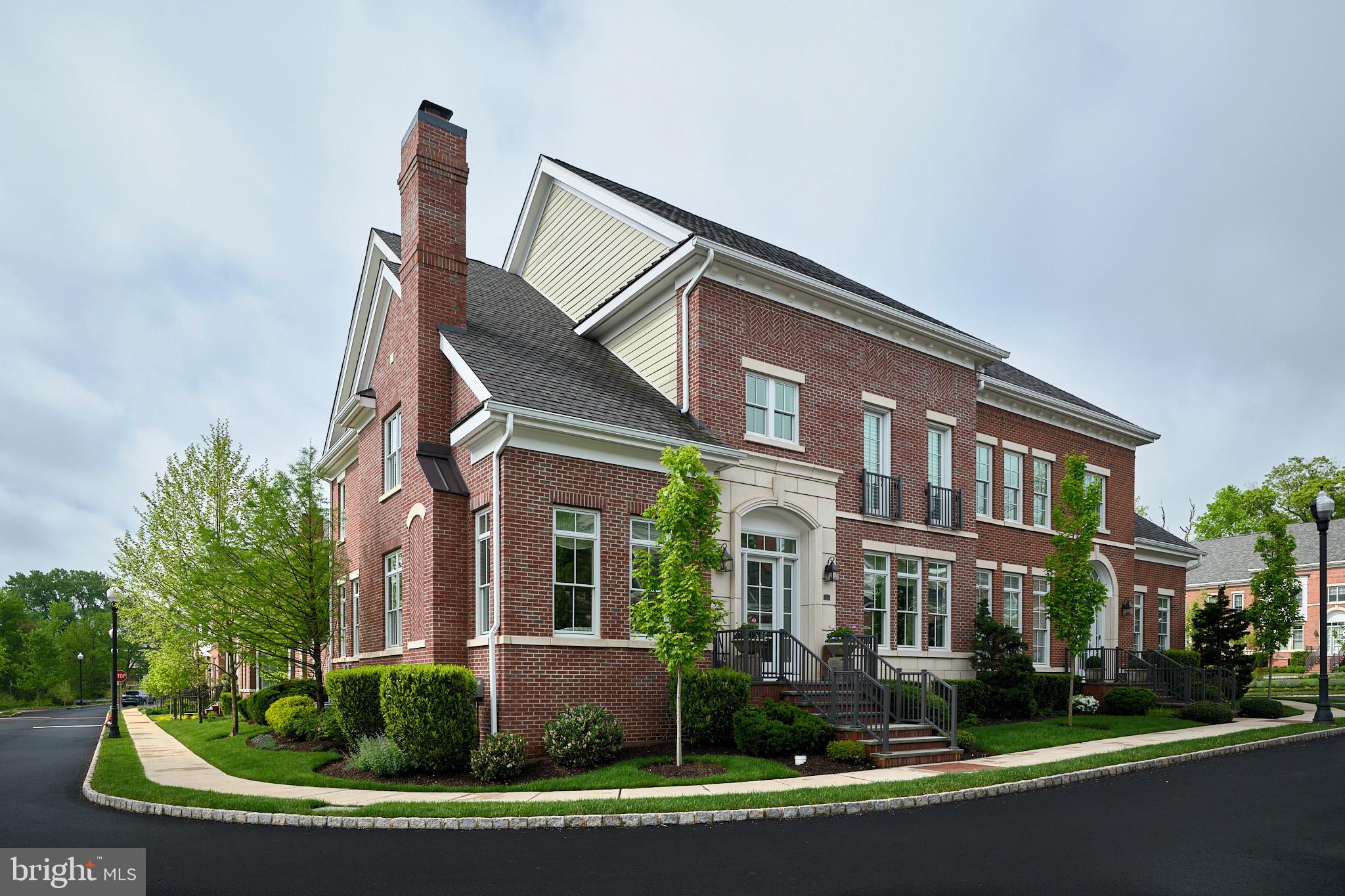 Proudly offering 20 Meadowbrook Court,  a stunning end unit located on one of the most premier lots in The Residences at Rabbit Run Creek. This gated enclave of 37 distinctive townhomes is reminiscent of  Georgetown architecture and is nestled on 20 verdant acres within walking distance to the canal path  and the town of New Hope. Keynotes of quiet luxury, refinement, and comfort are evidenced in its stately presence.  A full brick exterior (a customization unique to only 20 Meadowbrook Court and the original sample home) is offset by beautiful plantings, a commanding entry, and view of a well groomed pond. While its expansive open living spaces lay just beyond, those who enter are received in a formal front foyer flanked by the dining and  living rooms.  Passing through its double doors, the heart of the home awaits.  Wide board natural oak floors, smooth as silk beneath one's feet, sweep throughout the home, unifying its floor plan.  12’ ceilings, and a wealth of well placed  windows afford  the utmost privacy and are hosts for a sun-washed, airy interior. The open expanse, which is defined by function and decor rather than walls, creates a sense of harmony and oneness. Within this space is the great room punctuated by a fireplace boldly offset by Phillip Jeffries thin-shaved slate "wall paper", a casual dining area seamlessly melting into window walled access to the rear patio, the perfect spot for relaxation or alfresco dining.  An outstanding kitchen with Charles Weiler furniture-quality elmwood cabinetry features Wolfe, Miele and Sub Zero appliances and a large center island with a double thick honed Caesarstone counter.  Behind the kitchen is the butler’s service foyer with additional cabinetry,  a second sink, and a second dishwasher.  It offers a direct path to both the kitchen and the formal dining room and accommodates daily use or entertaining on a grand scale with equal ease.  Of note, the walk-in coat closet on the main floor and hallway linen closet on the second floor were offered as a location for an elevator by the builder and could easily be converted.  Upstairs, the main bedroom is a serene haven bathed in pale tones and enjoys a sitting area with fireplace, a tremendous walk-in closet and a spa like bath with heated floors, an open walk-in shower with a rainfall shower head, a freestanding Victoria & Albert oval tub, and a wall hung double sink vanity.  Bedroom 2 and 3 contain dedicated bathrooms.  Completing the second floor is an additional room that could serve as a study or 4th bedroom, a laundry room, and a hallway so generous as to be a room unto itself.  All closets are custom fitted and provide for exceptional organization.  Immaculate and graced with the finest quality appointments, this home glows with the intent invested in it and the care bestowed upon it.  This is truly a turn-key residence that redefines luxury as living the life of your dreams, even when no one is looking.