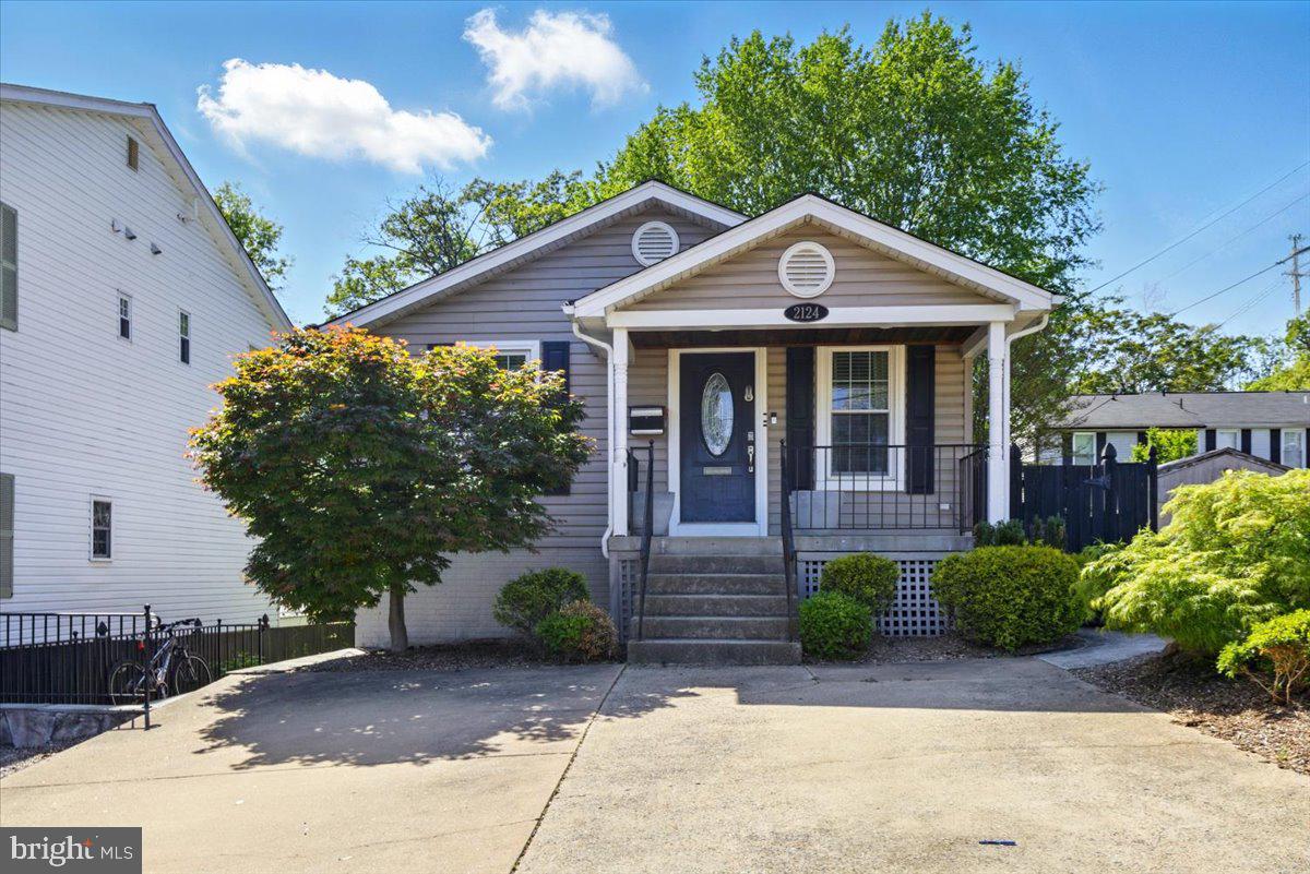 Charming 4-bedroom, 3-bathroom home featuring a spacious full lower level with 2 bedrooms, a full bath, a large kitchen, and a private outside entrance—perfect for guests or extended family. The home showcases beautiful hardwood floors, luxurious Crema marble bathrooms, and is very well maintained and professionally managed. Lovely rear patio area perfect for entertaining outdoors on summer evenings!
