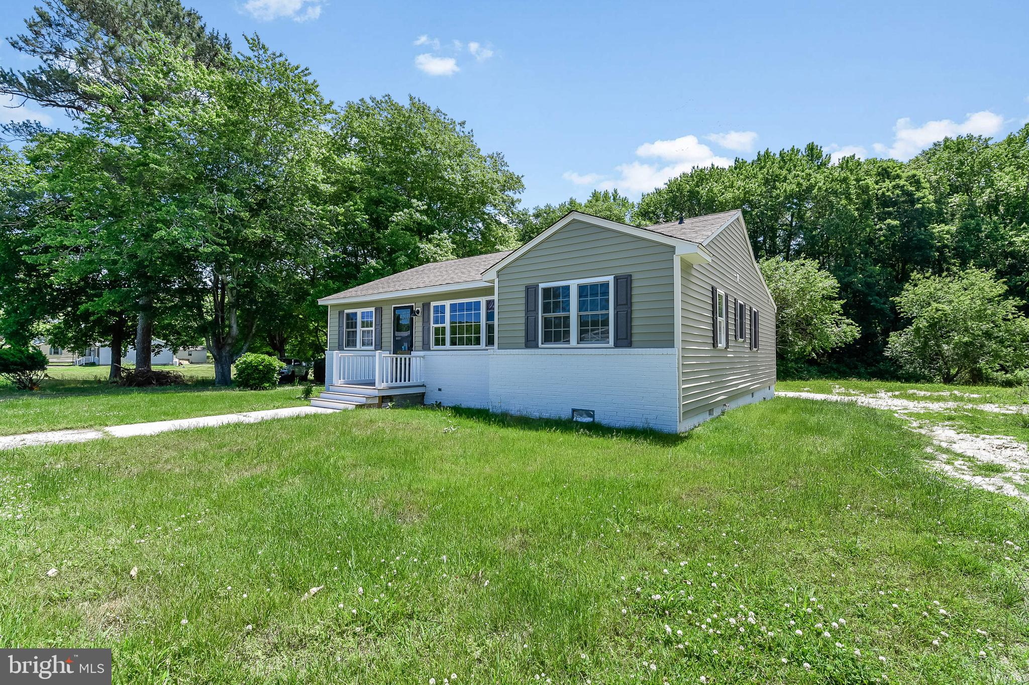 Totally remodeled home on one acre with over sized 2 car garage. Garage has half bath. Rest peacefully in the primary bedroom with ensuite bath. Both interior bathrooms are new. Beautiful new kitchen with quartz counter tops and stainless steel appliances. Just installed new septic system and heat pump. Nothing to do but move in and enjoy your new home. Professional pictures coming soon, but you may not want to wait.
