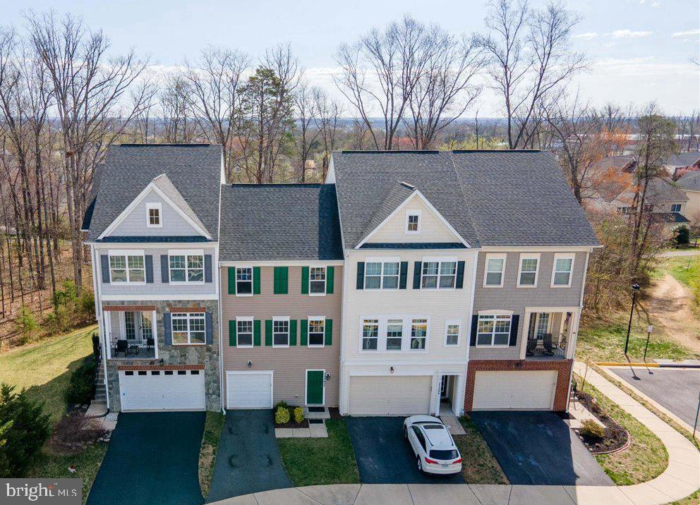 Absolutely immaculate 3 level, 3 bedroom/2.5 bathroom, 1 car garage town home on a premium  lot backing to tree buffer!  Light-filled level entry/full daylight floor plan.  Upper level 1 features an open concept layout with LVP flooring, beautiful kitchen with stainless steel appliances & breakfast bar, large family/living room & 1/2 bath.  Upper level 2 features an owners suite with full bathroom & 2 additional bedrooms & full bath.  Walk-out lower level features a recreation room/office area with french door to private, fenced rear yard with patio.  All of this just minutes from everything imaginable including numerous shopping centers, professional centers, Stone Springs Hospital, all major commuter routes & so much more!  All situated in a community of larger/more expensive 2 car garage town homes & single family homes!  Fantastic opportunity & a great value at this price!