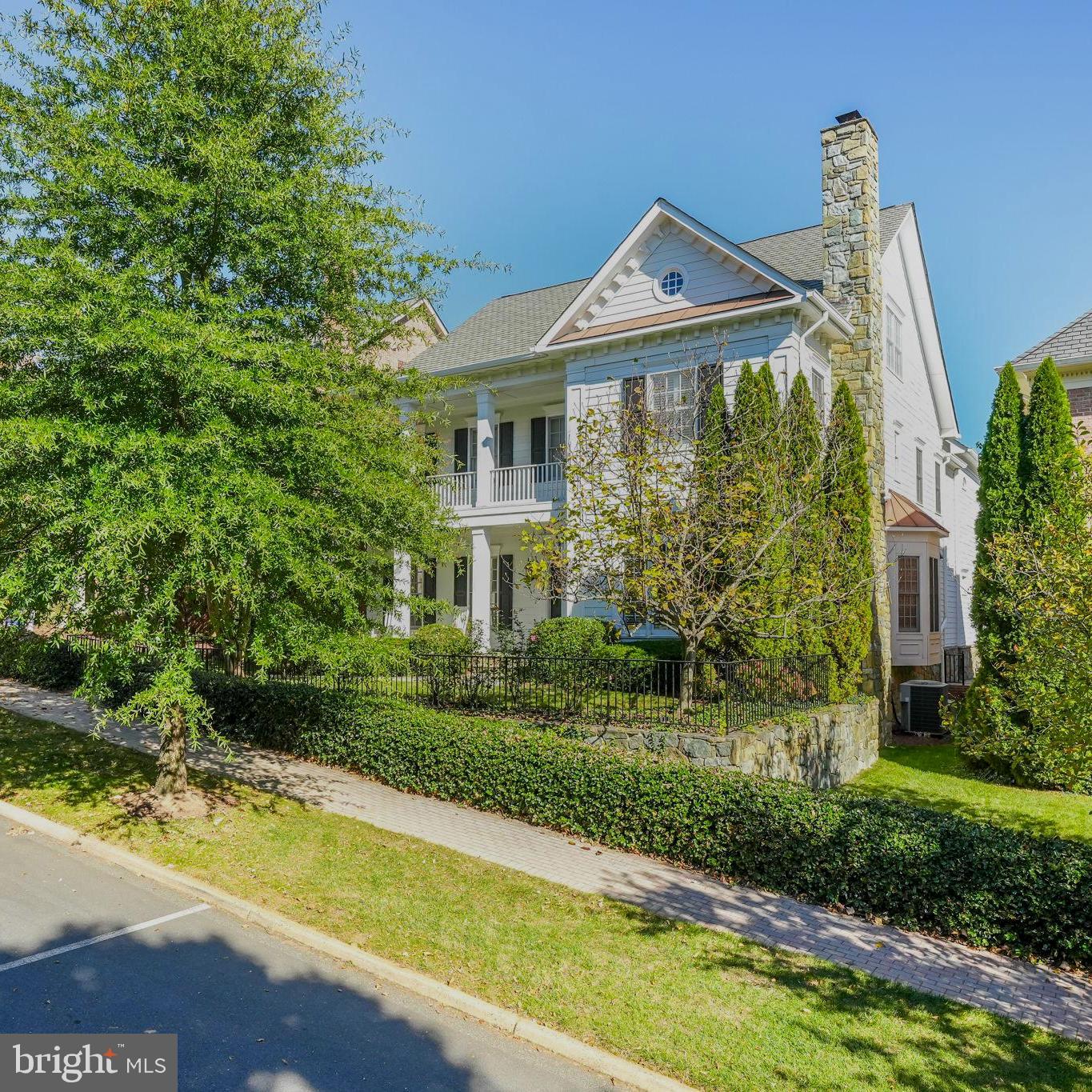 Stunning Perfection in Evans Farm- McLean’s premier gated community. The tree-lined development with manicured grounds, pond, and clubhouse is just minutes from downtown McLean, Tysons Corner, Metro’s Silver Line Metro Station, and all major commuter routes. This elegant, expanded Rosewell model is richly appointed with four perfectly finished levels with 5 bedrooms and 5 1⁄2 baths and close to $100,000 in improvements. It is a bright and sunlit home that has been impeccably maintained. A few of the recent updates include; gorgeous Schonbek light fixtures and new LED kitchen lighting, new HVAC system and steam humidifier, including new duct work to accommodate the 4th level, a full house generator (24KW), landscape and exterior lighting, a state of the art Security System including cameras, motion sensors and water sensors. This lovely home offers 4 fireplaces, and a rare 3 car oversized garage with considerable street and driveway parking. The bright and open entry level, with 10’ ceilings, features a welcoming foyer, an elegant living room with a fireplace, private office/study, formal dining room, and a cozy family room with a fireplace. The open floor plan offers an adjoining gourmet kitchen with a new oversized refrigerator and 2 dishwashers, a breakfast room and sunlit sitting room with a fireplace. Double doors lead to an expansive, private slate patio with a covered pergola. The upper level boasts a large primary suite with sitting room, desk area, and spa-inspired bath with an oversized dual entry shower. There are 3 additional bedrooms, 2 full baths, and a well-designed laundry room with a new washer & dryer that complete this level. The bonus 4th level has a theater room with an adjacent gym and full bath. The lower level is the home’s entertainment hub and boasts a recreation room with a fireplace, billiards area, bar, wine room, a full bath, and an expansive storage room. This is the perfect home in the perfect location.