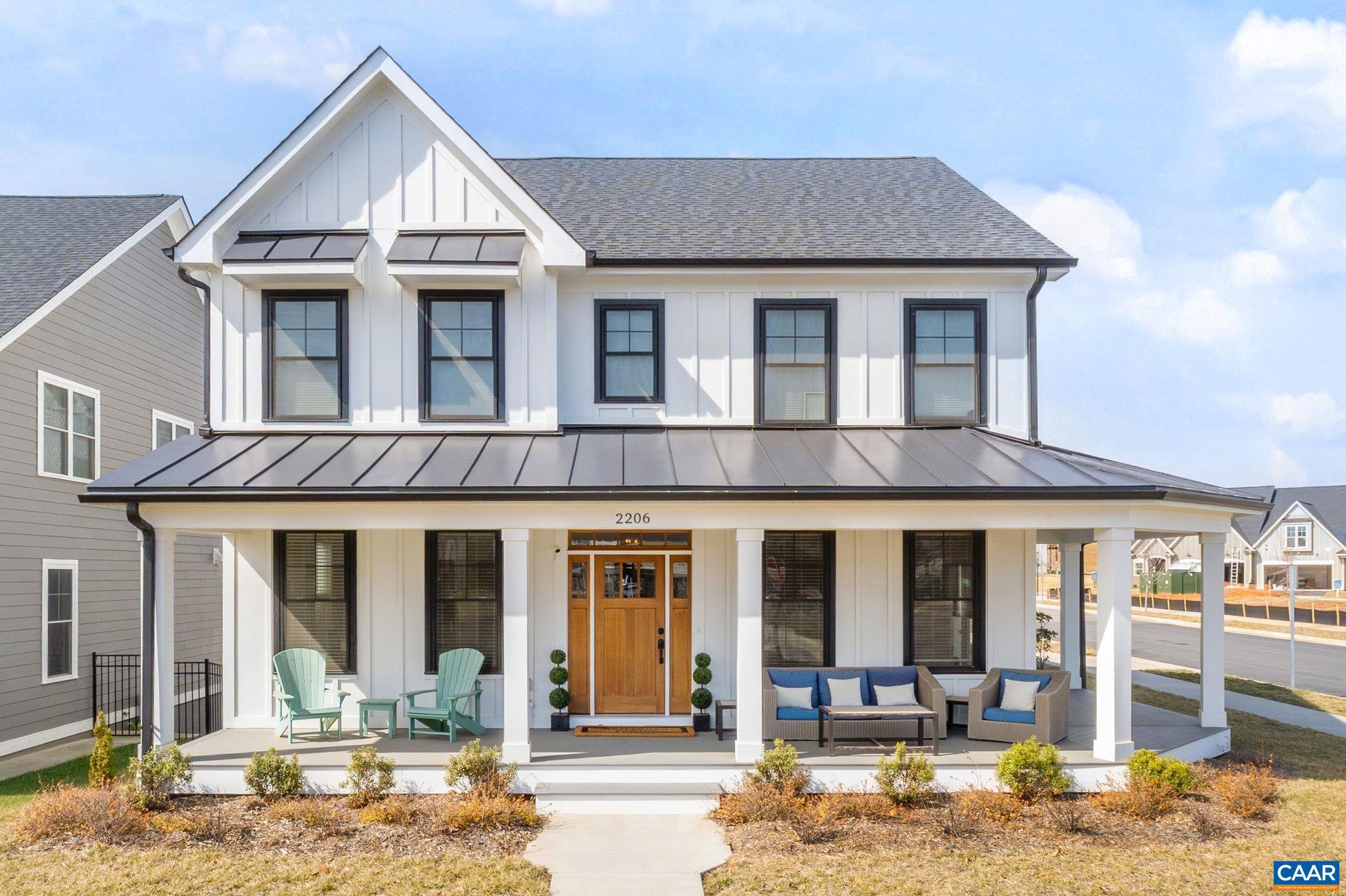 Now under $1.2M, this stunning farmhouse-style home in C'ville's Belvedere offers like-new construction without the wait. Natural light fills every room, while an 8' deep wraparound front porch highlights the beautiful corner lot setting. The main level features a first-floor primary suite with luxurious en-suite bath and laundry, an office/study, and a formal dining room. The chef?s kitchen includes a deep island, marble countertops, high-end appliances, and a butler?s pantry with second sink. The family room impresses with soaring two-story vaulted ceilings. Upstairs are three bedrooms, each with attached ensuites. The fully finished walk-out basement offers 10-foot ceilings, kitchenette, rec room, exercise room, 5th bedroom, and full bath. A side screened porch and rear patio create multiple outdoor living spaces. Hardwood floors, extensive trim and moldings, and abundant light blend modern comfort with timeless farmhouse charm. All in the heart of Charlottesville, just 4 miles to the Downtown Mall, while offering optimal suburban living. Belvedere features urban pocket parks, miles of trails, Rivanna River access, the SOCA indoor soccer facility, and seasonal community events.,Painted Cabinets,Quartz Counter,White Cabinets,Fireplace in Family Room