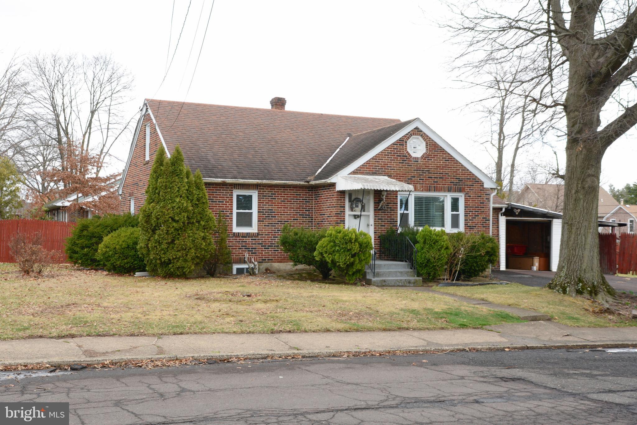 Don't miss this fantastic corner property in one of Souderton Borough's most desirable neighborhoods! This one is a true diamond in the rough.  First of all, let's talk about that yard-- this brick Cape Cod is situated on over 1/3 acre, featuring a spacious, fully fenced backyard perfect for gardening, entertaining, and outdoor play. The current owner has lovingly tended to multiple fruit trees on the property, including 3 persimmon trees, 2 cherry trees, 2 mature Asian pear trees, as well as apple, plum, pear, and fig trees. The attached garage offers convenient direct access to the kitchen, ideal for unloading groceries. With two bedrooms and a full bath on the first floor, this home offers easy single-story living, plus two additional bedrooms upstairs for added space. Original hardwood floors and newer windows are found throughout. Off the kitchen, a sunny bonus room overlooks the backyard, and there’s a convenient powder room nearby. The finished basement provides additional living space, along with a laundry area and utilities, including a brand-new hot water heater (2025). Located within walking distance to downtown Souderton, enjoy the vibrant local dining, bars, entertainment, and community events like 3rd Fridays and the holiday parade. This house is perfect for an investor or a handy buyer who wants a clean slate to make it their own!