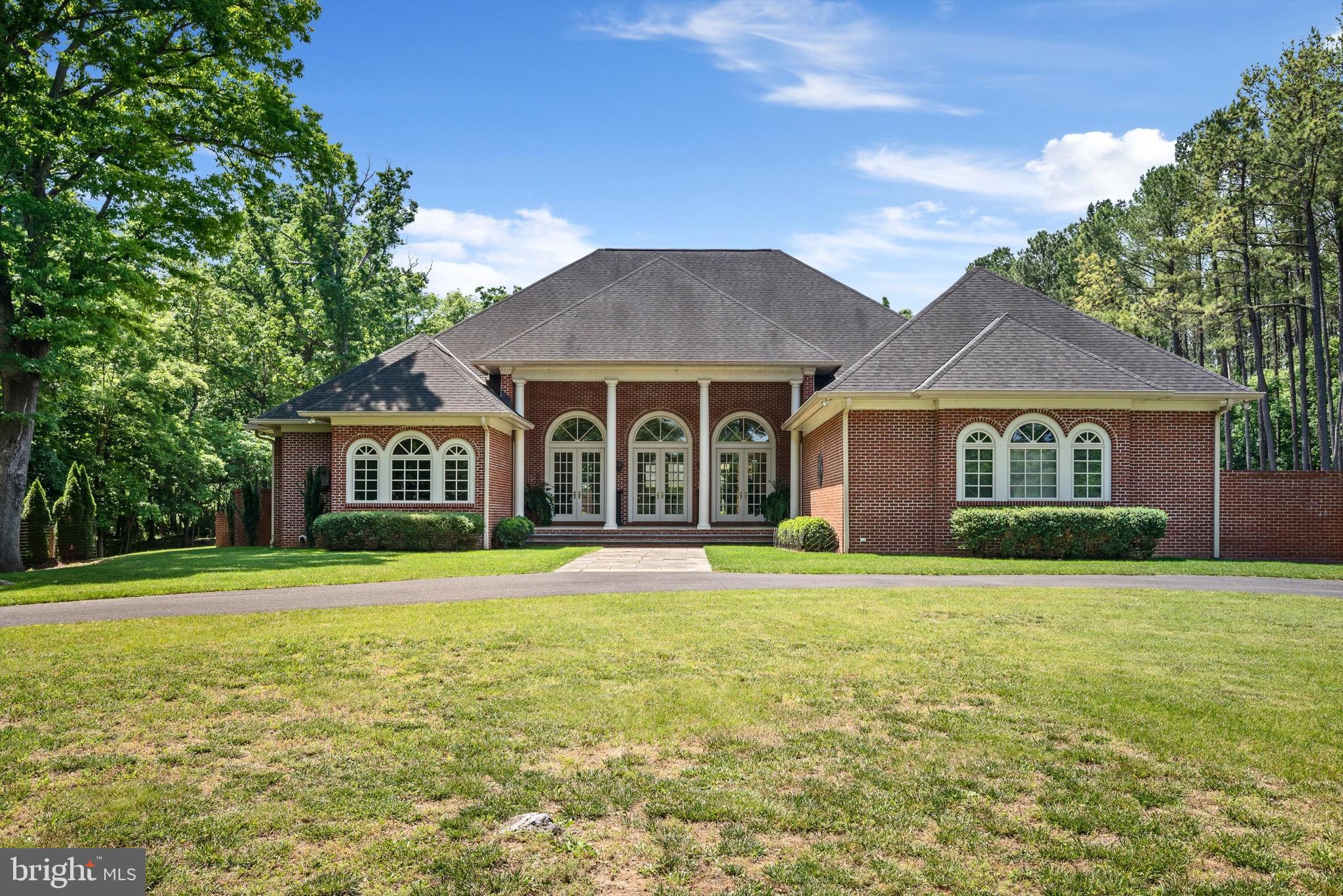 Remarkable country villa, on  34+ secluded acres of mature trees enjoys direct access to the Rt 7 corridor near Berryville. Design incorporates travertine and hardwood floors with stately interior and exterior columns.  Lovely pool complements resort style pavilion with outdoor fireplace and remarkable entertaining area in brick walled compound. Inspired design, quality craftmanship and materials.