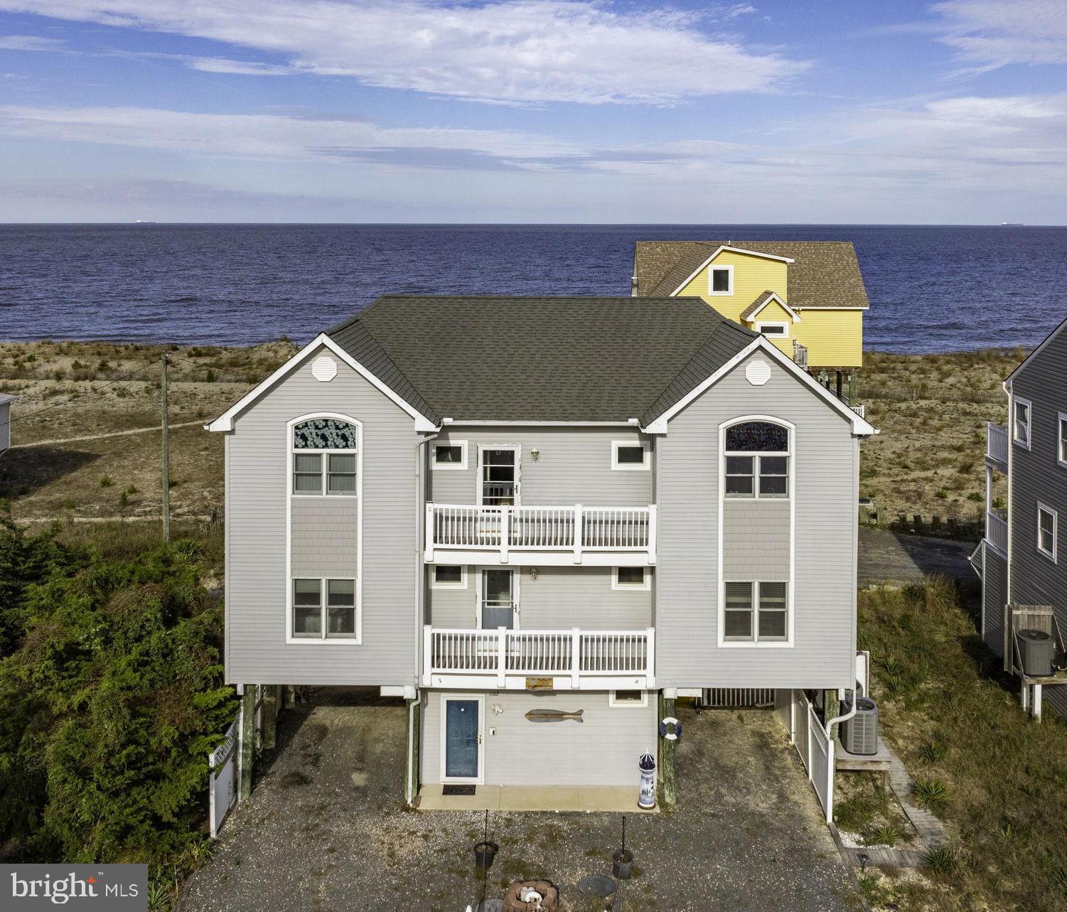Use a 2 Units or 1 large home.....Elevator, views and more! Discover coastal charm and versatility in this Broadkill Beach retreat, offering breathtaking views and a layout designed for both relaxation and opportunity. Set on a spacious double lot measuring 75x118, this beautifully maintained 3-bedroom, 2.5-bath home is thoughtfully arranged as two units, providing flexibility for rental income or multigenerational living. The property is currently set up for short-term rentals, with one unit renting for $350 per night or the entire home for $700 per night.

New roof in 2025. Built in 2006 and freshly painted, the home showcases quality updates and features throughout, including two new heat pump systems (installed in 2023 and 2024), a tankless hot water heater, and an elevator that is serviced annually for convenience and peace of mind. Elevator on all levels and entry to the elevator from the ground floor allow for ease of access and handicap accessibility. Other features include grab bars and safety handles in the bathroom.

Inside, enjoy open and inviting living spaces accented by luxury vinyl plank and tile flooring, with a cozy gas fireplace on each level creating warmth and charm. Both floors feature sunrooms/enclosed porches—perfect for year-round enjoyment—along with Juliet balconies that capture the natural beauty of Broadkill. The upper and lower decks provide additional space for outdoor dining, entertaining, or simply taking in the bay breezes and serene refuge views, which are protected and will remain unobstructed.

Additional highlights include a spacious attic with pull-down stairs for storage, an outdoor shower for rinsing off after beach days, and the benefit of being sold mostly furnished, making it truly move-in ready. 

Experience the best of coastal living—where peaceful views, thoughtful design, and rental potential come together in perfect harmony at Broadkill Beach.