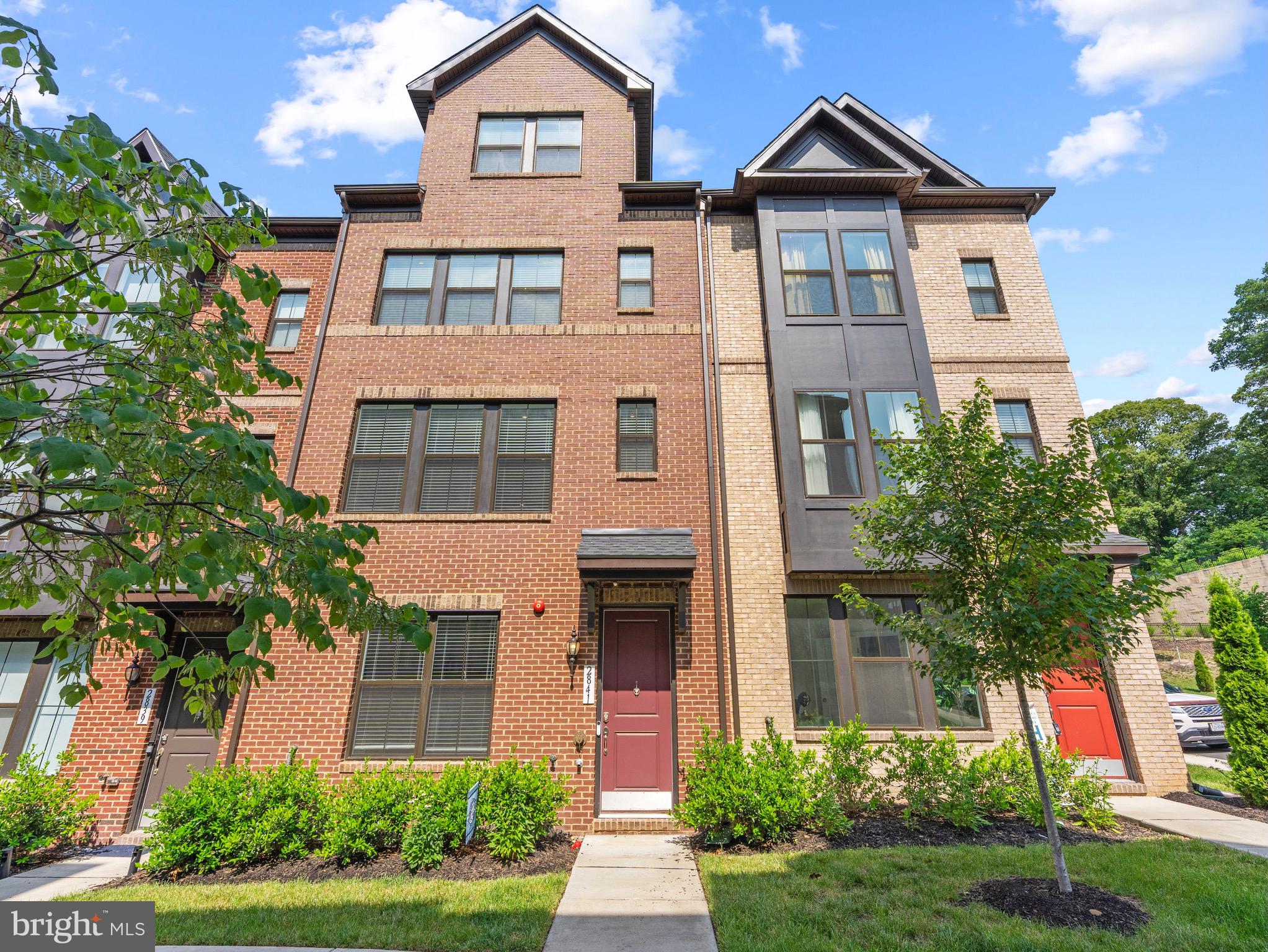 Built in 2022, this stunning four-level townhome offers over 2,100 square feet of thoughtfully designed living space with 4 bedrooms, 3 full and 2 half bathrooms, and modern finishes throughout. Upon entry, you'll find a versatile lower-level living area that makes the perfect family room, home office, workout space, or guest retreat complete with convenient half bath and access from the rear-load garage. The open-concept main level is perfect for everyday living and entertaining, featuring a gourmet kitchen with quartz countertops, upgraded white cabinetry, gas cooktop with hood, GE Profile appliances including a built-in microwave and wall oven combo, a large center island, stylish chevron backsplash and seamless flow into the dining and living areas. Upstairs, the spacious primary suite serves as a private retreat with a luxurious en-suite bath and large closet. Generous sized secondary bedrooms offers access to the hall bath and laundry closet. The versatile upper-level loft creates the perfect flex space for a home office, media room, or guest suite and opens to a private rooftop terrace ideal for relaxing, entertaining, or enjoying evening sunsets. Additional highlights include a two-car garage, abundant natural light, and contemporary finishes throughout. Ideally located just minutes from Old Town Alexandria, Fort Belvoir, Huntington Metro, Kingstowne, and major commuter routes, this home offers the perfect blend of luxury, convenience, and low-maintenance living. Don't miss this opportunity to own a like-new home in an unbeatable Alexandria location!