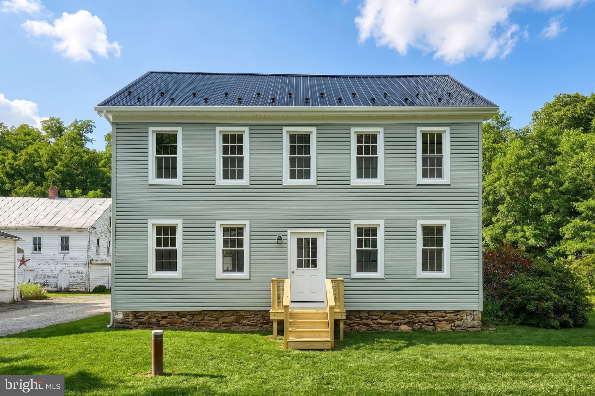 Beautifully rebuilt from top to bottom, this 4 bedroom, 1 full bathroom home at 13 Maul Ave. offers 2,184 sq. ft. of finished living space on a usable 1+ acre lot in Felton, within the Red Lion Area School District in southeastern York County. This is not a simple cosmetic renovation—the home has been taken down to the details and renewed with a brand new roof, new siding, new double-hung double-pane windows, new HVAC, new electric, new plumbing, and modern finishes throughout. Inside, the first floor provides ample living space with a well-laid-out kitchen that anchors the main level, featuring brand new hardwood floors flowing throughout the entire first floor, brand new stainless steel appliances, and an included washer and dryer for true move-in-ready convenience. All four bedrooms are ample in size, and the primary bedroom features a walk-in closet, adding the kind of storage and function buyers are looking for today. The blend of old-house charm and fresh, clean updates gives each room character while keeping daily living low-maintenance and efficient. Outside, the oversized, mostly level yard offers plenty of room for outdoor activities, gardening, pets, or future improvements, making the acreage genuinely usable rather than just something on paper. If you’re looking for a turn-key home with classic character, modern systems, and a great lot in Felton, 13 Maul Ave. deserves a spot on your must-see list.