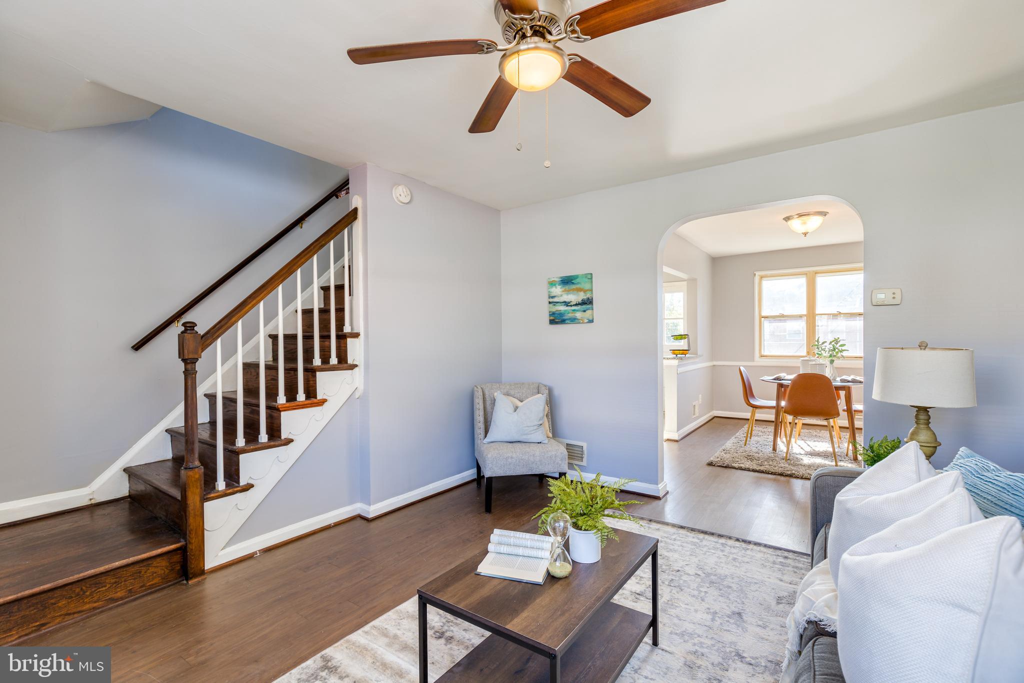 PICTURE PERFECT RENOVATION WITH 3 FINISHED LEVELS!  Features include hardwood floors throughout, spacious living room, separate dining room, Chef's kitchen w/ granite counters, ss appliances, & tile backsplash, upper level with 2 generously sized bedrooms and 1 full bath, finished basement that is perfect for a family room or possible 3rd bedroom, and a main level balcony overlooking the fenced yard!  Convenient to shopping, restaurants, and major roadways!