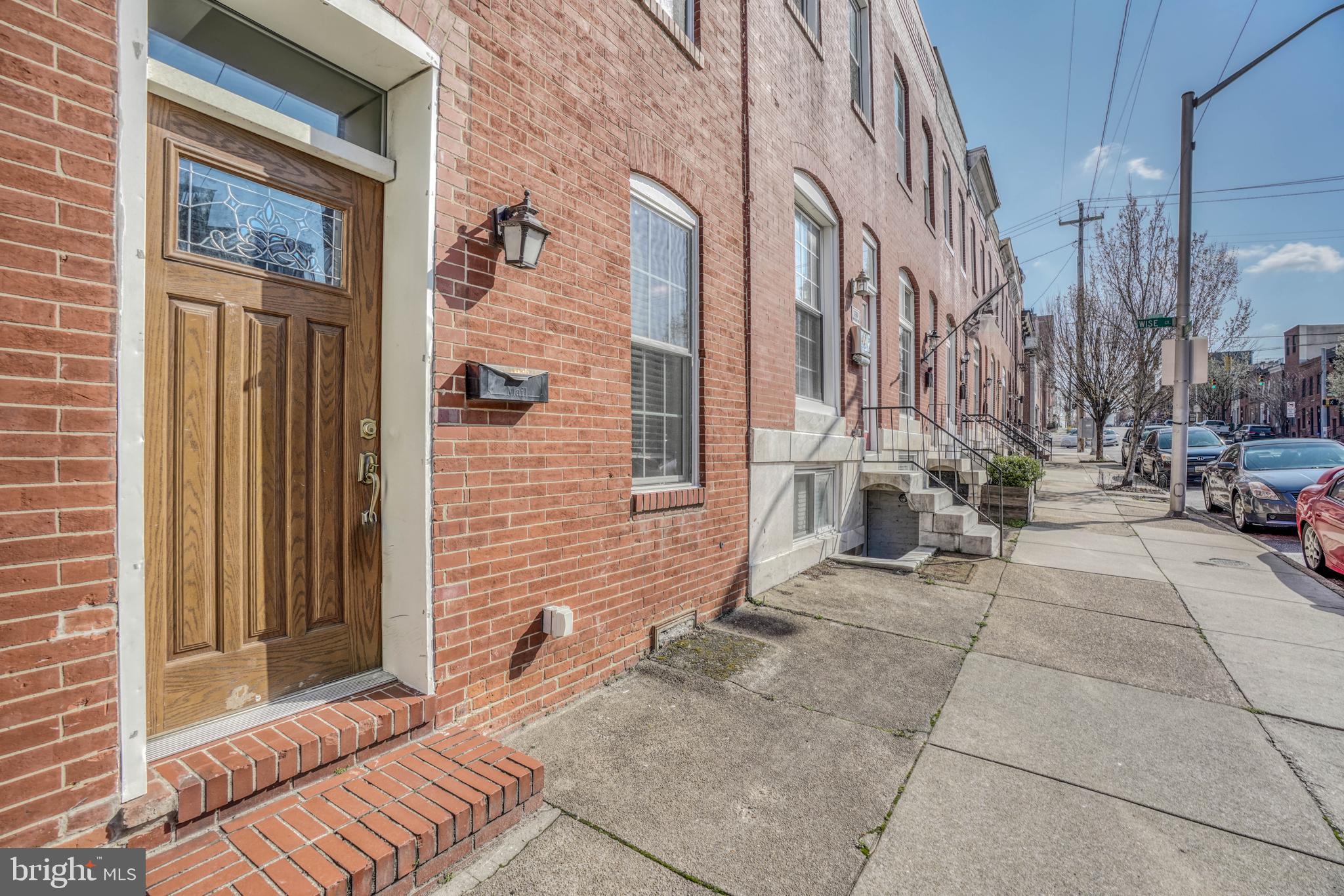 One of a kind, fully renovated amazing rowhome with every bell and whistle! Walk right into this long, open and inviting 1st floor with wood floors, exposed brick, floating stairs, large living room, crown molding and a gourmet kitchen with a surplus of cabinet and pantry space. Rear entrance leads to a fenced in rear patio perfect for backyard BBQ and entertaining.  2nd floor boasts 2 beautiful bedrooms with wood floor, EACH with an attached luxury full bath and tiled shower. The beautiful & inviting middle area can be used for a sitting/reading area/library with built-in bookshelves. Third floors features rear master bedroom with attached full bath and front area is a wet bar with 1/2 bath leading to rooftop DECK with the VIEWS! Basement area is partially finished and can be used for an office/recreation room or possible 4th bedroom includes built in bookshelf and entertainment area. Make this your new DREAM HOME and start living the CITY LIFE!
