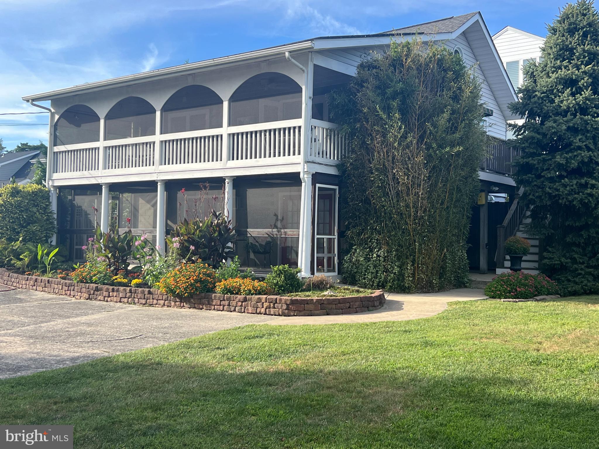 Amazing opportunity to own a 2 BR+ loft home with a 1 BR in-law suite less about 2 miles from the beach in a waterfront community!  You won't want to leave the huge, screened porch with views of the water, wetlands and Thompson Island!!This adorable cottage was remodeled to give an open floor plan and vaulted ceiling.  Main home bath has heated floors.  Loft could easily be converted to a 3rd BR.  First floor features a spacious 1 BR ADU with an equally large, screened porch.  The oversized lot (77 x 100) leaves ample room for a pool.  With 20 owned solar panels the home has been net-zero energy usage!!  Ample parking for all of your guests.  Bay Vista features a private marina for boating enthusiasts.  In-law suite has been rented year-round in the past for $1200/mo. (electric included!) but could easily rent for more!!  The upstairs has rented as an Air B&B in the past, generating approx. $26K renting only in the summer season!  The 2 units share a common laundry area and an outside shower.   Seller has made several recent upgrades and has maintained the home well. Imagine the potential!  New homes on smaller lots are selling in the $1.5M range!  Scoop this up now, build your dream home in the future!