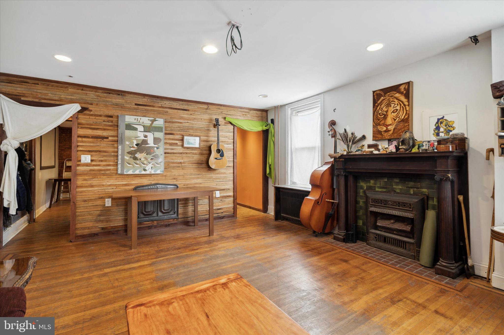 Incredible multi-unit building with 2 garages in stellar Fishtown location!  This mixed-use property offers commercial space, which can be used as 1 or 2 units, a bi-level, 2br 1.5 bath apartment and 2 garages with a bonus shed. The front commercial space has a large main studio, a smaller rear room/bonus space, access to the basement for storage, half bath, wood flooring and glass block windows that offer privacy and great natural light.  Perfect for a dance or yoga studio, office space, retail; the possibilities are endless.   The rear commercial space offers 2 rooms and a half bath with its own private entrance.  Each room features exposed brick and the front room has a large glass block window.  The 2nd & 3rd floor are home to the 2br, 1.5bath apartment; a truly unique living space.  The main floor of the apartment is home to an expansive living room with ample natural light, original wood floors, a faux fireplace and a wood accent wall. This room is equipped with hook-ups for a projector and speakers. The dining room boasts exposed brick, a unique wooden wall installation, a custom bar area, hardwood flooring and is equipped with hook-ups for 4 ceiling speakers in each corner and a projector in the center of the room. Also on this floor is the large custom kitchen featuring stainless steel appliances, a gas stove with an electric convection oven, built-in dishwasher and ample cabinetry; a home cooks dream.  There is also a beautiful custom made island/table crafted from a local bowling alley’s lanes, perfect for entertaining or additional prep space. Off the kitchen is a small powder room perfect for everyday convenience and access to the roof deck; an amazing space.  The 3rd floor is home to both bedrooms, each well sized, with large exposed built-in closets and wonderful natural light. The washer and dryer is situated in the hallway with a convenient shelf built in for storage. The full bath features a soaking jacuzzi tub with jets, a 3-headed shower with waterfall shower head, heated floor, built-in ceiling speakers and a motion sensored light over the toilet for complete comfort; a dreamy and relaxing space. The 2 garages are located to the rear of the property off of Cedar street.  To access the bonus shed simply walk out of the kitchen and across the roof-deck.  This space has built in shelving and a staircase that leads down to the garage as could be built out to use as a studio/bonus space or storage.  AN IDEAL PROPERTY FOR AN OWNER OCCUPANT OR INVESTOR!!  Located steps the Frankford Ave corridor and all Fishtown has to offer and with easy access to the 95, the Frankford-Market Line, & Aramingo Ave shopping this location has it all!