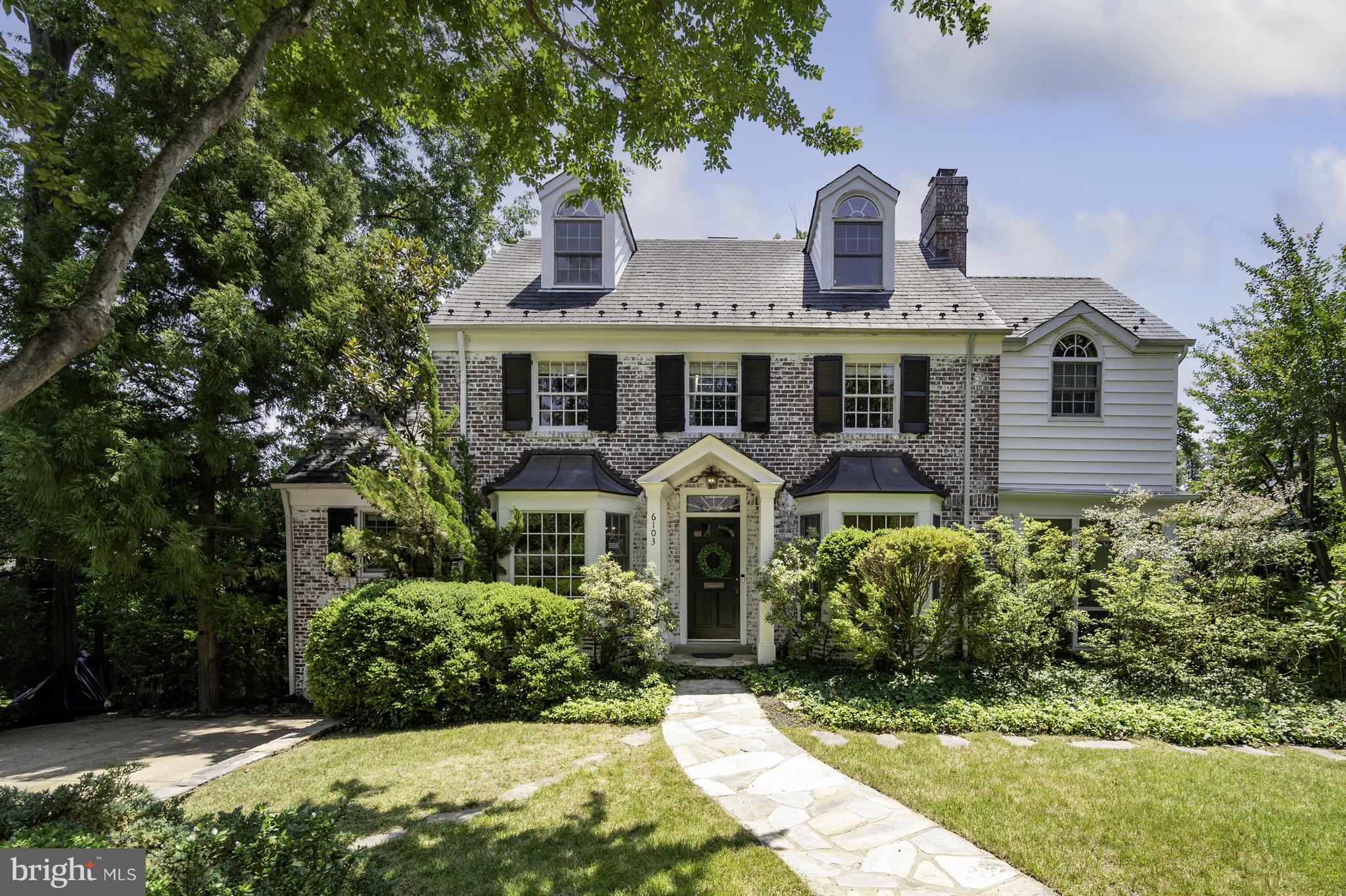 THE OPEN HOUSE HAS BEEN CANCELLED FOR TODAY AND TOMORROW!  Located between Saunders Circle and Fort Willard, this home is at the heart of the Belle Haven Community.  6103 Woodmont Rd beckons you in through its gated arch and beautifully landscaped front yard offering you a place to make lasting memories!   Bay windows flank the front door of this Center Hall colonial and complement built-ins which  can hold and display your special china.   The gracious dining room is perfect for seating and entertaining a large dinner party.  The kitchen is open to the dining room and offers spacious cabinetry, stainless steel appliances including a Fisher Peykel refrigerator, a GE double oven and stove, a pantry, and 2 windows letting in natural light.  The breakfast area and family room are surrounded by a wall of windows and views of the gorgeous backyard garden and trees.  The fireplace in the living room creates a cozy atmosphere and the adjacent screen porch provides great pleasure spring, summer, and fall.   On the second floor, the owners' suite contains 2 cedar closets and a dressing room with more closet space.   The ensuite bath has a walk-in shower and double sinks.  The charming second primary bedroom boasts an ensuite bath, dressing room, and huge walk-in closet.  On the 3rd floor, architectural windows enhance the 3rd and 4th bedrooms with a full bath.  The fully finished downstairs area is completed by a large rec room/playroom, an office with built-ins for wine storage, a bedroom with ensuite bath, a laundry room, and a huge, conditioned storage area.  The .28 acre lot offers 2 - 3 parking spaces in the driveway. This home is in walking distance to the Belle Haven Country Club, close to the GW Parkway and bike path, I-495, excellent shopping, Old Town restaurants, and Huntington Metro.  Photos will be taken tomorrow.