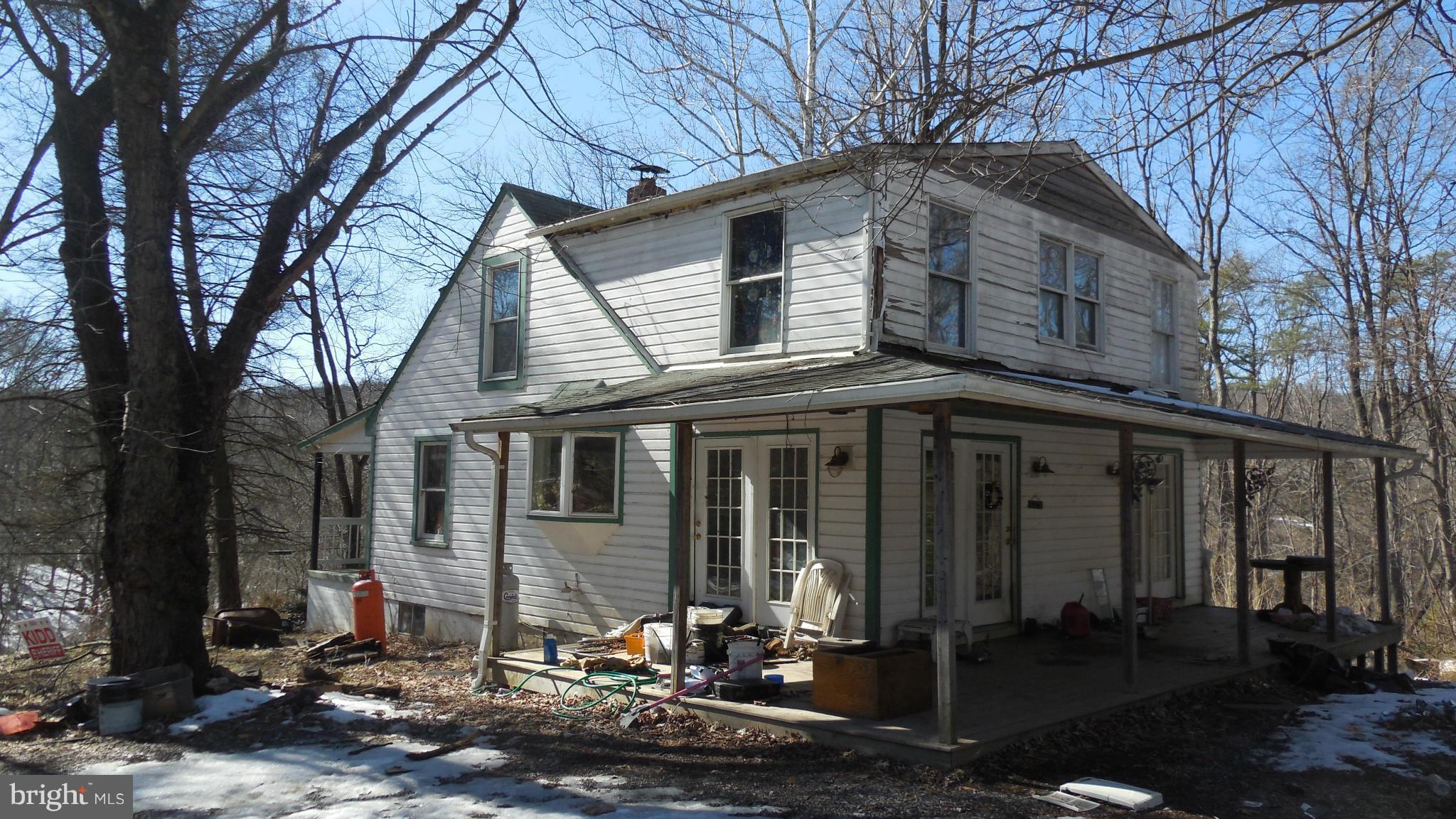 First contract fell thru. Seller accepting Cash (Preferred) or Renovation Loan Only.  4+/-  acre lot has privacy outside historic Harpers Ferry.  Good bones in Cape Cod style home. Needs work but potential for great home.  Freddie Mac First Look initiative ends April 14, 2014. Seller will provide up to $500 towards Home Warranty for owner occupants only. Age unknown. Sold As-Is.