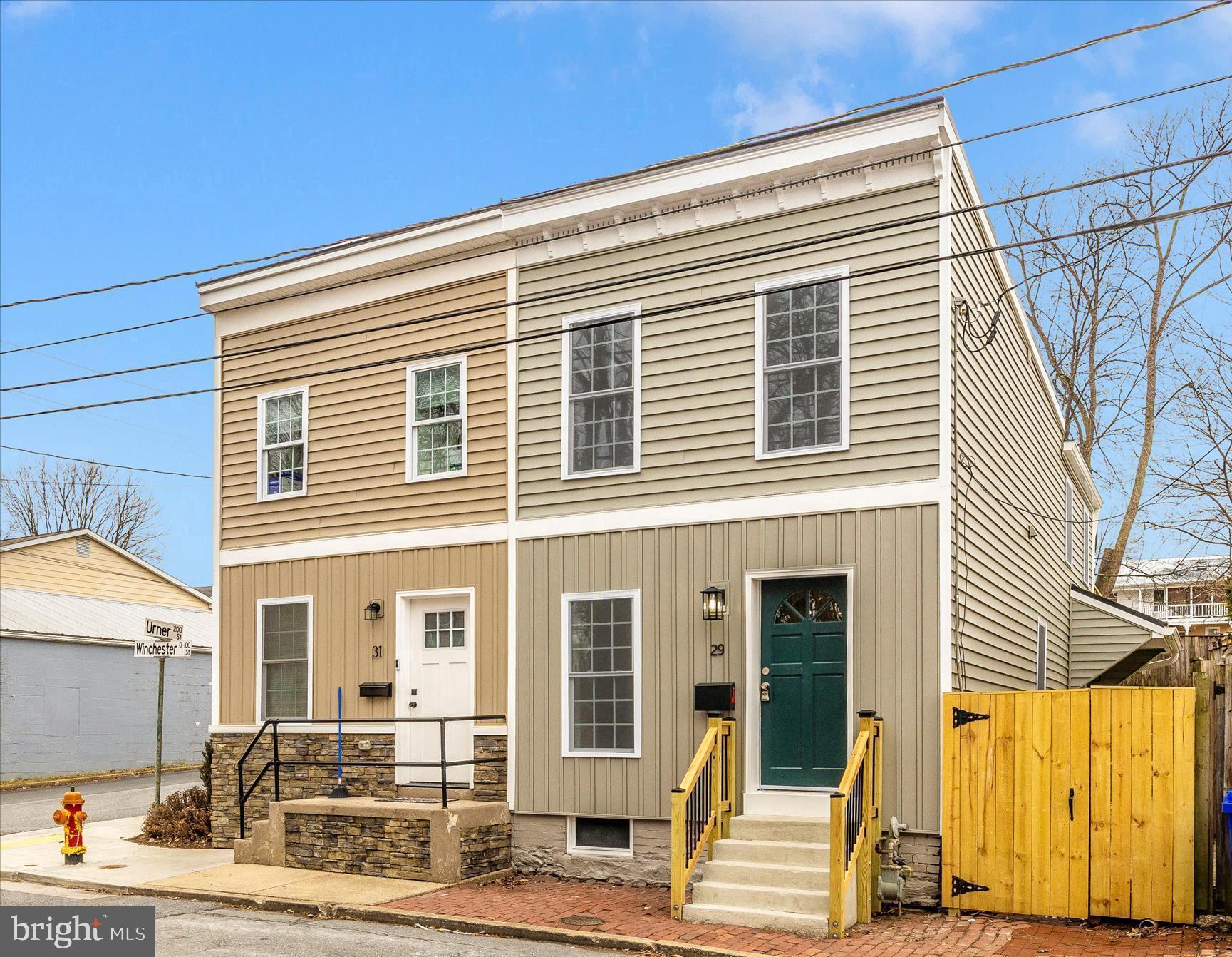 SELLER WILL CONSIDER ALL OFFERS AND WILL HELP WITH BUYER'S CLOSING COSTS. Fully renovated inside and out and walking distance to the heart of downtown Frederick!  Discover this beautifully renovated townhouse in the heart of downtown Frederick, just steps from the vibrant shops, dining, and entertainment of historic downtown. Completely updated from the inside out, this move-in-ready home blends classic charm with modern upgrades. Step inside to find a brand-new kitchen featuring stylish new cabinetry, new quartz countertops, and new dishwasher.  Other appliances include a stainless steel refrigerator, range, microwave and front-load washer/dryer on upper level.  The fully renovated bathrooms offer fresh, contemporary finishes, while new flooring flows seamlessly throughout the home. Fresh paint brightens every room, creating a clean and inviting atmosphere. Major improvements provide peace of mind, including new siding, roof and windows. The primary bedroom offers a private deck—an ideal spot to enjoy your morning coffee or unwind in the evening.  Outside, enjoy your own private retreat with a patio ideal for relaxing or hosting guests, plus a fully fenced backyard offering both privacy and space for pets or play.  Located within walking distance to the heart of downtown Frederick’s boutiques, restaurants, parks, and community events, this turnkey townhouse offers the perfect combination of location, comfort, and style!