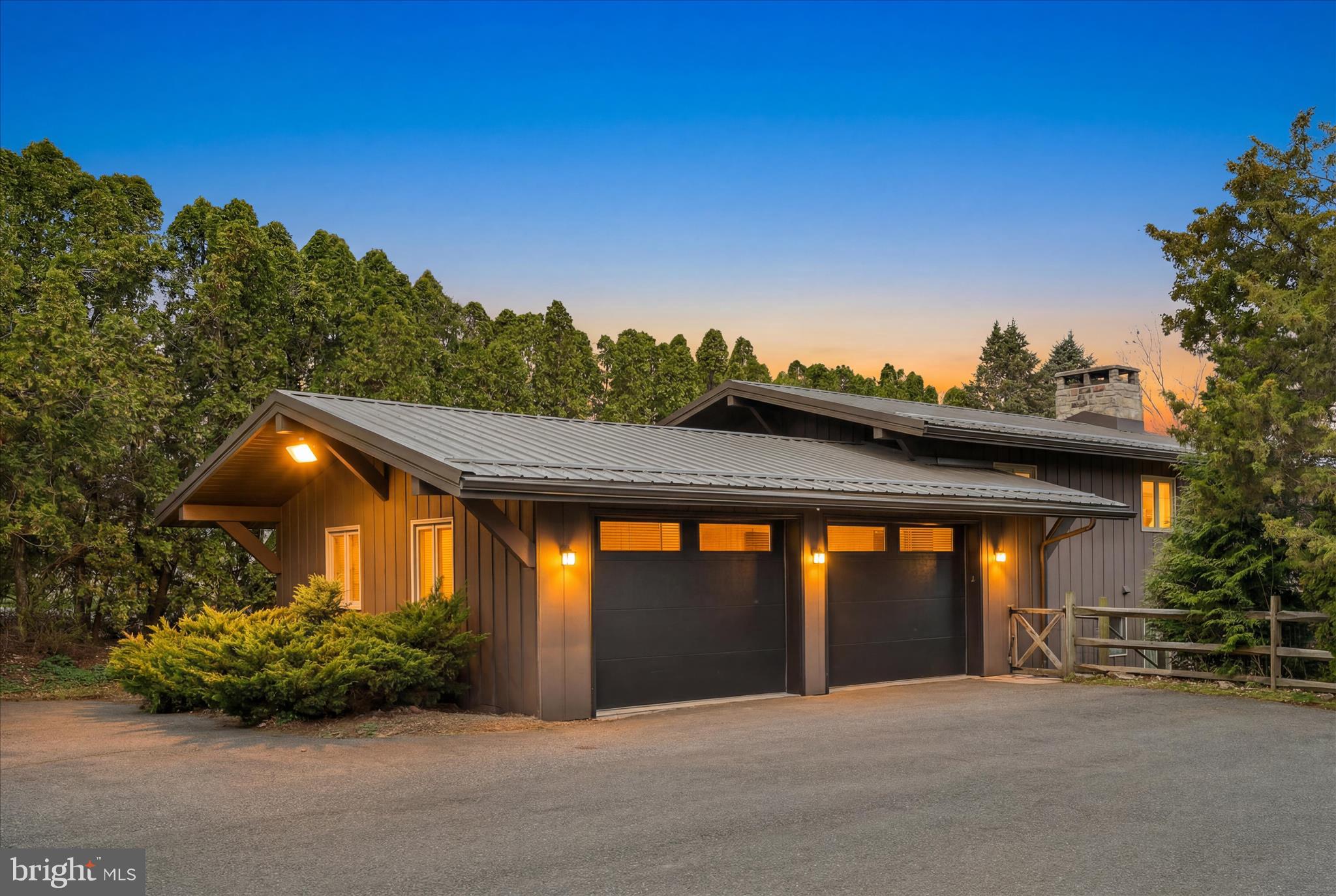 An amazing opportunity - This beautiful home is priced $120,000.00 under October 2025 appraised value due to the Lake Wynonah Dam rehabilitation project. Align yourself for the future! 
Nestled on an expansive 1.09-acre lakefront lot with a relatively easy stroll to the waterfront area, this stunning 3-4 bedroom, 2-bathroom home offers 2,016 square feet of beautifully updated living space with breathtaking sunset views. Step inside to a vaulted living room that draws the eye upward, setting the tone for this thoughtfully modernized home. The genuine, historic stone wood-burning fireplace anchors the main floor, blending timeless charm with contemporary updates. An updated kitchen with above cabinet lighting boasts sleek quartz countertops, while hardwood and tile flooring flow throughout. Neutral paint colors and new sliding doors with built-in blinds flood every room with natural light. The lower level expands your living possibilities with a spacious family room, propane fireplace, bedroom, bathroom, kitchenette, and direct exterior patio access — kept perfectly dry thanks to "The Rain Escape" system overhead. Outside, this property truly shines. Enjoy 120 feet of waterfront from your private composite dock, or relax on the large composite deck featuring state-of-the-art cable wire railing and dual staircases. Mature maple trees, Cryptomeria, arborvitaes, and a split rail fence create a private sanctuary. Notable features include a durable metal roof, annually maintained EcoFlo on-site septic system, heat pump with central air, and a two-car garage with electric openers. Water and electric available lakeside. 2 Kayaks, Paddleboards and Hot Tub are included, and some furniture is negotiable. List of improvements in Documents. Conveniently located near C Dock park, the Lodge and Grove, courts, Sunny Cupboard bakery, Summit View Restaurant, local grocery stores and a new hospital, this lakefront gem is ready for you to call home. Lake Wynonah is a gated community featuring 2 freshwater lakes. Amenities include: business office/gathering room/library, lodge w/dining and bar, social clubs, non-power/trolling boating, fishing,  paddleboarding, tennis, pickleball, several parks/pavilion, basketball courts, horseshoe pits, pool, beautiful docks, hiking trail, natural wildlife and marina. Active Civic Association, Fish & Boat Group. Located approximately an hour from Allentown, Harrisburg, Hershey and Reading. Close to Philadelphia and surrounding suburbs. Please call the Lake Wynonah Business Office for updates regarding the Lake Wynonah Dam. Boating is restricted to electric/trolling motors only while the Lake Wynonah Dam is being rehabilitated. Some photography displays Lake Wynonah at full pool. Please call the Lake Wynonah Business Office for updates on the "big lake"/Lake Wynonah Dam rehabilitation project and probable future assessment. Taxes may not reflect 2026 assessed value.