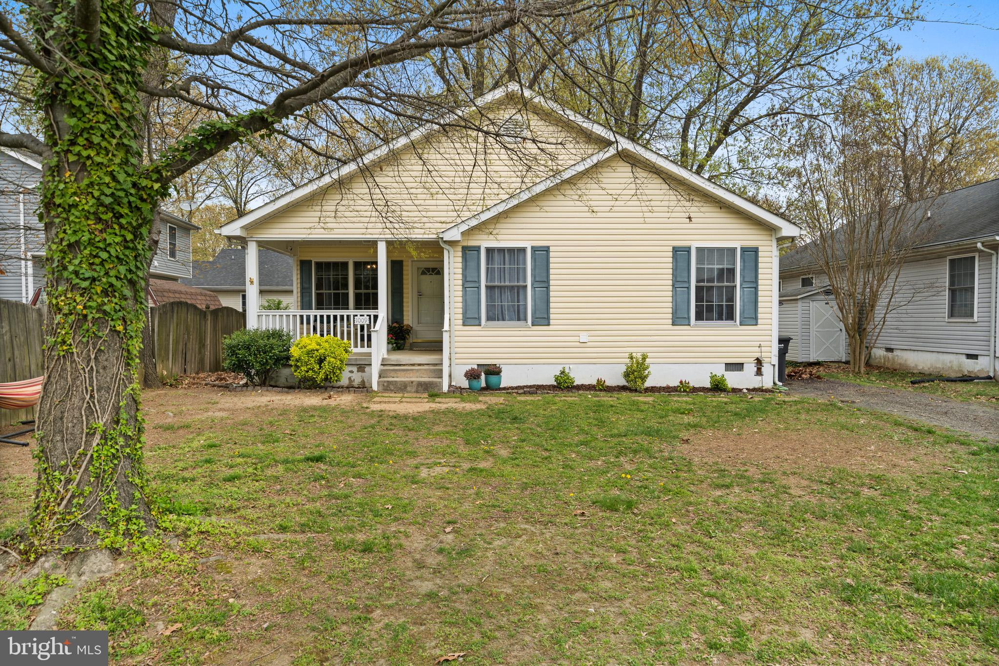 Welcome to this charming rambler with over 1400 sq ft of living space. This 3-bedroom, 2-full-bath home features a desirable open floor plan with a split bedroom layout, offering both functionality and comfort. The kitchen boasts a breakfast bar and table space, perfect for casual dining. The spacious living and dining area is ideal for gatherings and entertaining. Step through the sliding glass doors onto your private deck overlooking a fully fenced backyard—great for relaxing or outdoor fun. Enjoy quiet mornings on the inviting front porch, the perfect spot for your coffee or favorite book. Just a short walk to the local beach—soak up the sun, sand, and water all summer long! Shed in backyard conveys. Upgrades include fully encapsulated crawlspace and HVAC system. See agent remarks!