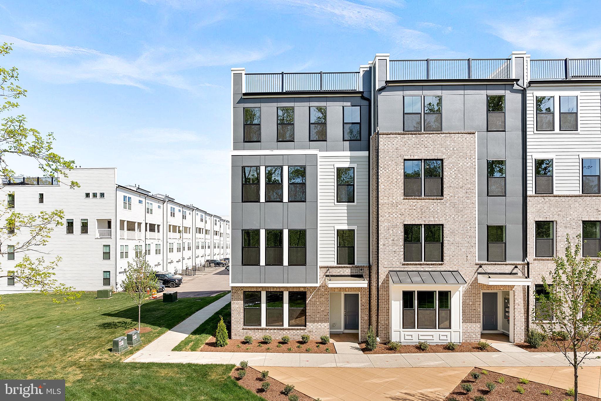 Introducing this brand new, two-level Rosslyn condo that blends functionality and comfort all together. Enter through your one-car rear-load garage or your front door. The main level features luxury vinyl plank flooring and offers an open-concept floor plan. Recessed lights compliment the family room and the modern kitchen includes upgraded pendant lighting, quartz countertops, stainless steel appliances, and a walk-in pantry. A conveniently located powder room also compliments this level. The stairs and second level include upgraded carpeting. The primary suite features a tray ceiling with added recessed lighting, two separate walk-in closets, and a primary bathroom to include a frameless shower glass door with a bench, quartz-topped dual-vanity sinks, and upgraded tiling throughout. The laundry room is conveniently located right off of the primary, making laundry day a breeze! The large second and third bedrooms are right down the hall and share a full hall bathroom also with upgraded tile throughout and quartz-topped dual-vanity sinks. This specific lot faces trees and greenery, so you don't have to worry about neighbors in front of you. Kincora is conveniently located right off of route 28 and a short drive to route 7, Dulles Airport, Dulles mall, grocery stores, and so much more!