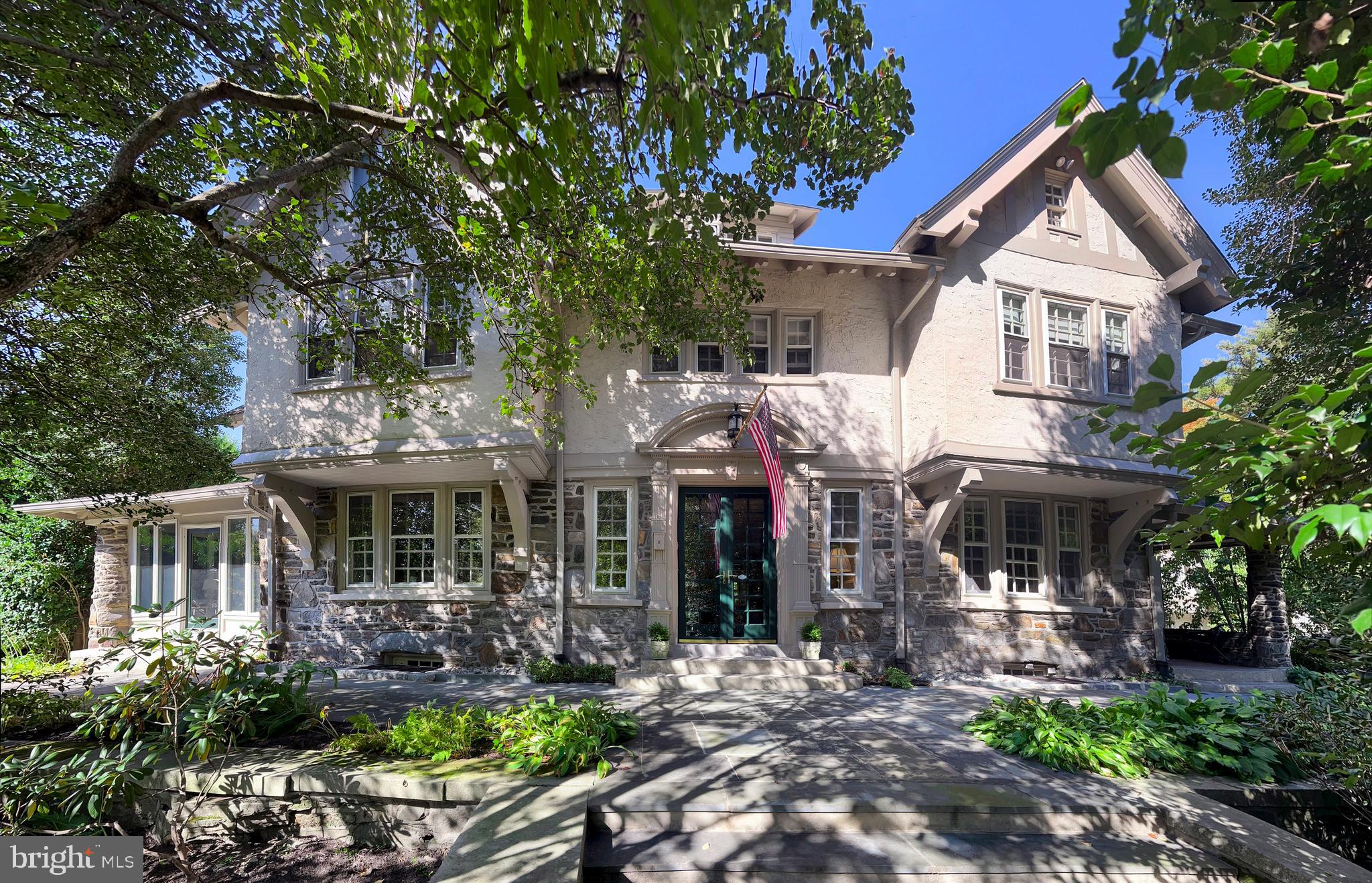 Welcome to 122 Mill Creek Road, a stately stone Colonial home brimming with original character and versatile living spaces. This expansive property features at least 5 bedrooms and 4.5 baths, with numerous additional rooms that can be tailored to your needs—whether as bedrooms, offices, or hobby spaces. Situated on .52 acres, this residence offers a unique combination of historic charm and boundless opportunity.

This home offers the convenience of being within walking distance to Suburban Square, a premier lifestyle destination featuring a curated mix of retail and unique dining options.   Additionally, the nearby Ardmore train station provides a short ride to Center City Philadelphia, enhancing your lifestyle with easy access to urban amenities.  

Upon entering the home, the first floor greets you with a grand foyer, leading to a spacious living room, formal dining room, and a sunroom that invites natural light and tranquility. The kitchen and family room are thoughtfully positioned at the back of the home, offering a seamless flow for entertaining. A powder room completes this level.

The second floor boasts 5 bedrooms, including a sunroom off one that makes for a perfect office or sitting area, along with 3 full baths and a convenient second-floor laundry.

The finished third floor provides 4 additional rooms and a full bath, with two rooms currently configured as offices. This home also features six fireplaces, adding warmth and character throughout.

The detached garage includes a finished space above, complete with an old clawfoot tub and roughed-in plumbing—ready for your renovation vision.

While this home does not have air conditioning, it is equipped with gas heat. With its timeless moldings, detailed craftsmanship, and abundant potential, this property is a rare opportunity to create your dream home in a storied setting.