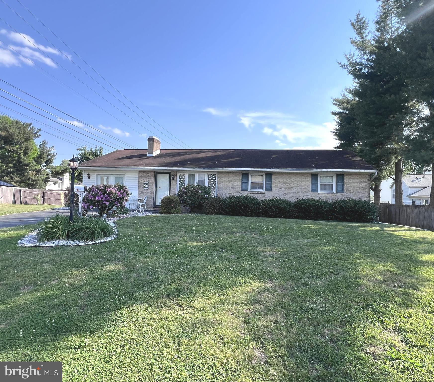 Welcome home to this lovingly maintained 3-bedroom, 1-bath brick rancher offering the ease and convenience of one-level living. Built in 1965, this solid home combines timeless character with important updates already completed, including a newer CAC system, replacement windows, and an updated bathroom.

Original hardwood floors add warmth and charm throughout much of the home, while the inviting living room features a wood-burning fireplace, creating a comfortable space to relax and unwind. The finished former carport provides valuable additional living space and flexibility for a family room, home office, hobby area, or den. Buyers may also explore converting the space back to a carport or garage, subject to their own due diligence.

Step outside to enjoy the rear patio overlooking the level backyard, offering space for outdoor dining, gardening, entertaining, or simply enjoying a quiet evening at home. Ample driveway parking provides plenty of room for vehicles and guests.

The lower level offers excellent storage space along with additional finished square footage ready for a recreation room, workout area, workshop, or other flexible uses.

Whether you're purchasing your first home, looking to simplify with one-level living, or seeking a well-built property you can personalize over time, this home offers a wonderful opportunity. Enjoy the quality construction and enduring appeal of a classic brick rancher while adding your own style and touches at your own pace.

Conveniently located with easy access to I-70, shopping, dining, and everyday amenities. Being sold As-Is as part of an estate sale, yet reflects years of pride of ownership and care.