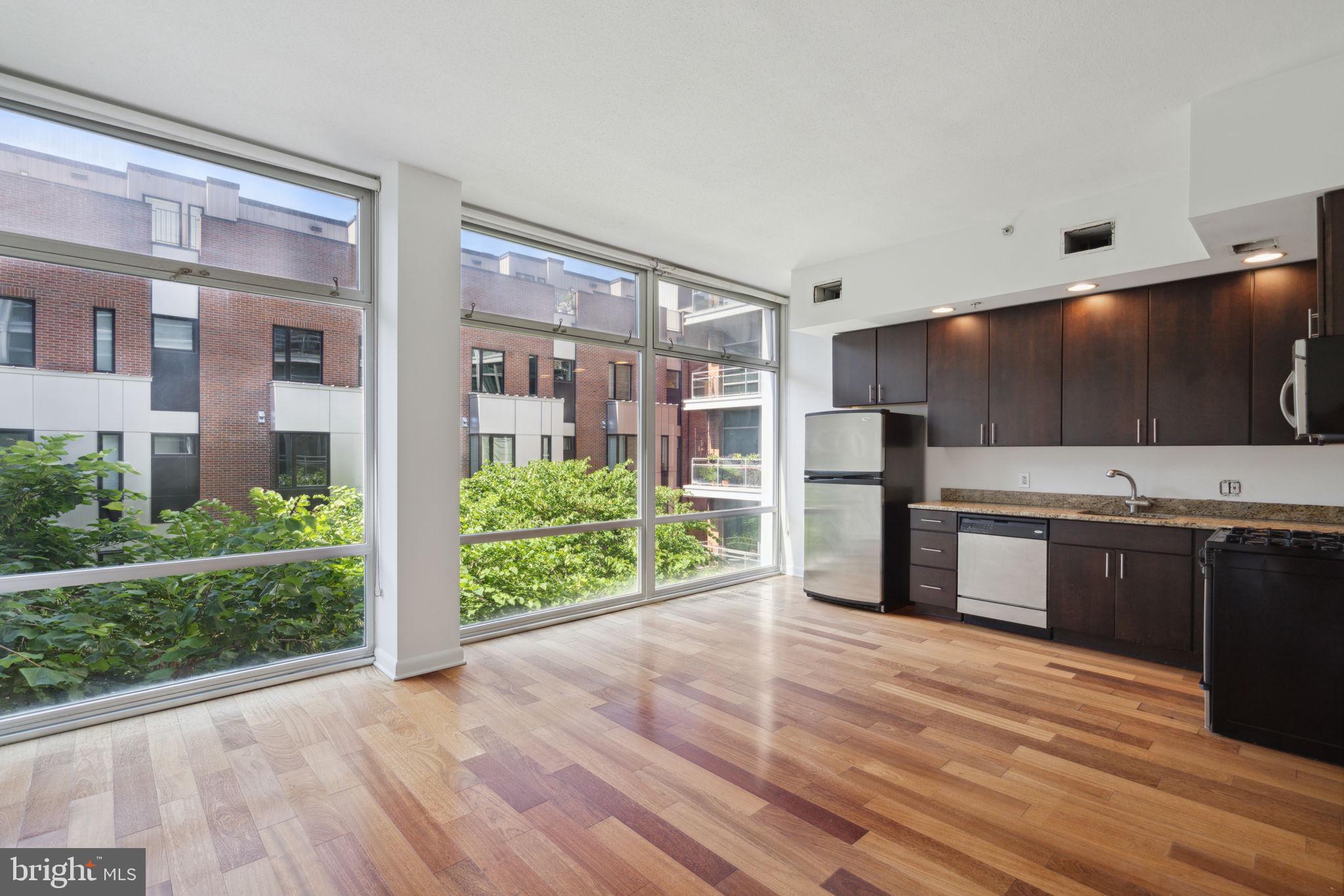 Sun-soaked one bedroom loft-style condo with a wall of floor-to-ceiling windows and modern finishes throughout. The residence features hardwood floors; an open kitchen with wood flat-panel cabinetry, stainless steel appliances and granite countertops; a generously sized loft bedroom; and contemporary bathroom with radiant heated floors. There is a washer and dryer in the unit.
One of just a handful of doorman buildings in Old City, 22 S Front is within walking distance to world class restaurants,  night life, and historical sites. Built in the mid-2000s, residents of the 42 unit, eight-story building enjoy a beautifully appointed lobby, landscaped courtyard, and a shared roof deck offering panoramic views of the city skyline, Benjamin Franklin Bridge, and the Delaware River waterfront. Dogs and cats welcome!