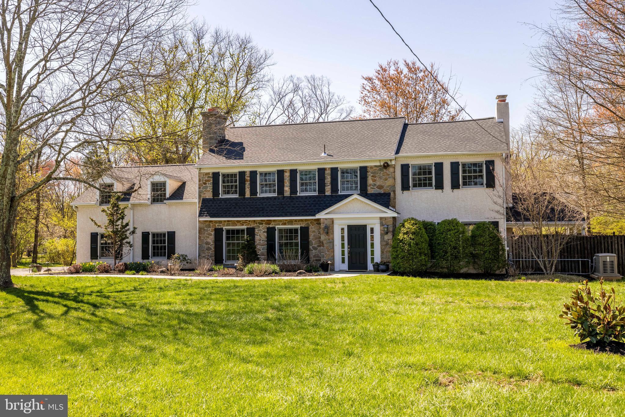 Welcome to this wonderful Lower Gwynedd residence, offering over 4,100 square feet of thoughtfully designed living space, complete with three fireplaces and a heated in-ground saltwater pool, all nestled on a serene and park-like 1.37-acre lot.
From the moment you arrive, a charming slate walkway guides you to both the front and side entrances, setting a gracious tone. Inside, the foyer offers a warm welcome, leading to a spacious living room on the right complemented by a large dining room on the left—each featuring a cozy fireplace and an abundance of natural light. The living room opens directly to a covered porch, perfect for enjoying the fresh air during spring and summer. 
The thoughtfully renovated kitchen flows seamlessly into the windowed breakfast area and family room, creating a bright and open space ideal for everyday living and entertaining with picturesque views of the lush surroundings. The family room exudes warmth with rustic wood beams, a raised fireplace with brick surround, and a picture window overlooking the side yard. An inviting side patio near the kitchen offers a favorite spot for grilling and dining al fresco.
A versatile office or den sits conveniently between the main hallway and family room. Off the garage entrance, a spacious mudroom with a separate laundry area and extra storage helps keep things organized. A powder room completes the main level.
Upstairs, you’ll find five bedrooms and three tastefully updated bathrooms. The primary suite includes a walk-in closet plus two additional customized closets and a renovated en-suite bath. A wide hallway connects the additional four bedrooms and two baths, with the fifth bedroom offering flexibility as a guest suite, home office, or cozy pajama lounge. A cedar closet adds bonus storage to the second floor.
Important improvements elevate this home’s timeless appeal: public sewer and expanded natural gas line have been added, along with a full-house generator, new roof, and replaced windows. Hardwood floors run throughout the home, preserved under removable carpet in the upstairs hallway, bedrooms and stairs.
The heated saltwater pool, fully renovated in 2023, is fenced-in and ready to enjoy this summer. Over the years, this home has been the backdrop for countless cherished memories, including two weddings. It truly embodies a relaxed, welcoming atmosphere that makes it a joy to come home to.
Ideally located just steps from Lower Gwynedd’s scenic trails and only 0.6 miles from one of three SEPTA train stations to Center City, this home offers unbeatable convenience. It’s part of the award-winning Wissahickon School District, with both the high school and middle school accessible by a nearby trail. Enjoy proximity to terrific restaurants, shopping, and all your daily essentials.
Don’t miss the opportunity to make this exceptional property your forever home—schedule your showing today!