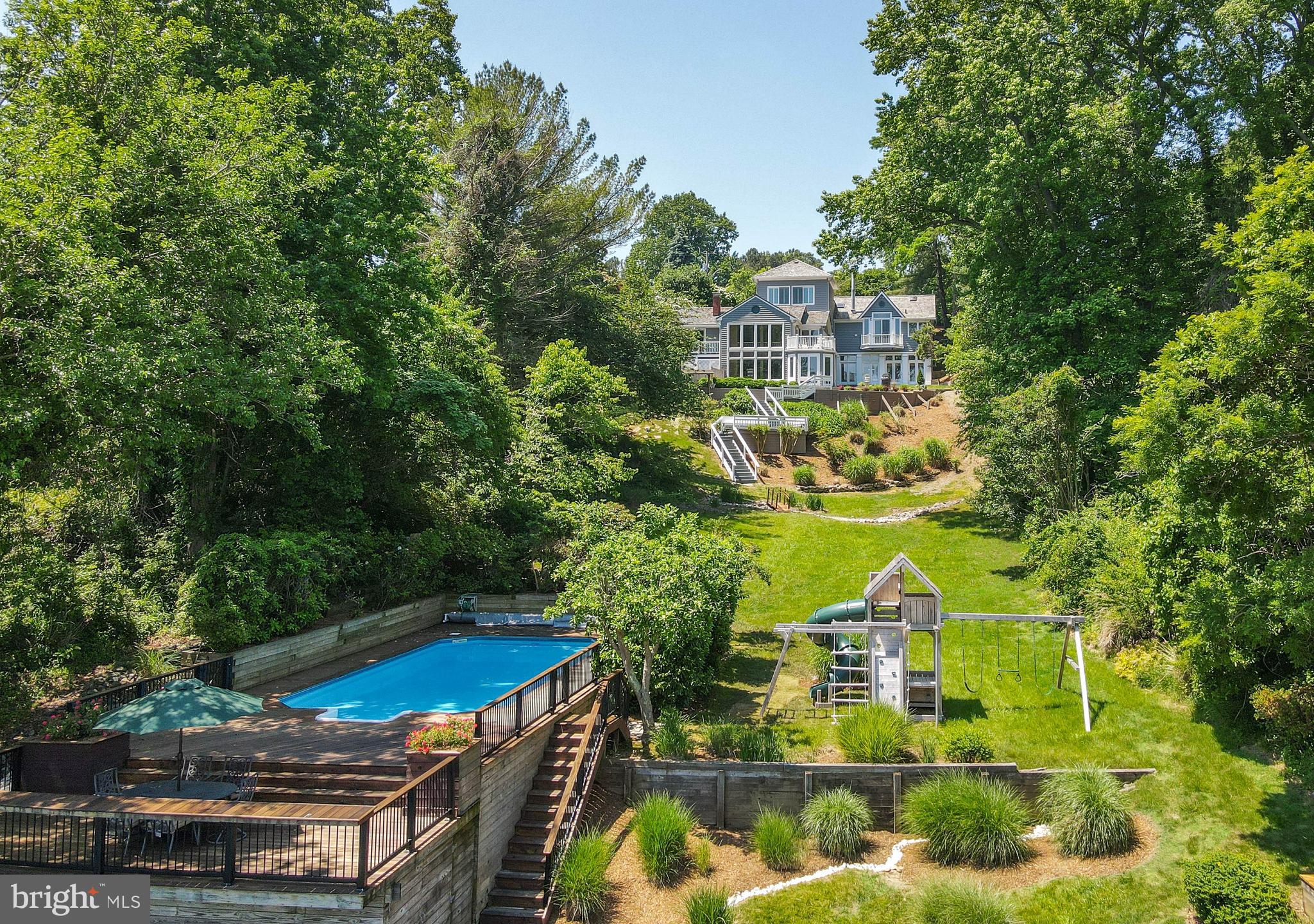 This 5,000+ sq ft coastal property on 1 acre captures Chesapeake Bay Views and vivid sunrises from the balconies, decks and patios, gazebo, grassy lawns, playground and nearly every room in this distinctive multi-level home / The waterfront swimming pool showcases new Ipe decking that extends from the pool to a lower tanning deck and overlooks a pier with 10,000 lift /  Saltillo tile flooring is introduced in the Foyer and compliments the oak floors covering 2 levels, while stone and ceramic tile floors extend throughout all social spaces and bedrooms on the waterside walkout levels / A dramatic 2-story wall of windows optimizes the Bay views while other areas exhibit lofty vaulted ceilings with exposed beams / Additional features include 3 fireplaces, Wolf and Dacor kitchen appliances and artful tilework on display in all bathrooms / Ample parking for numerous vehicles and a large boat plus a paver driveway with ATV or small vehicle access to the back yard / Great weekend get-away or full-time waterfront living only 30 min to Annapolis and 10 min to Chesapeake Beach and North Beach / Consider short-term rental income potential from for the weddings and events at Herrington Harbour, just 7 min away / Roof replaced in 2019 / Pier can be extended 75' for 5'MLW