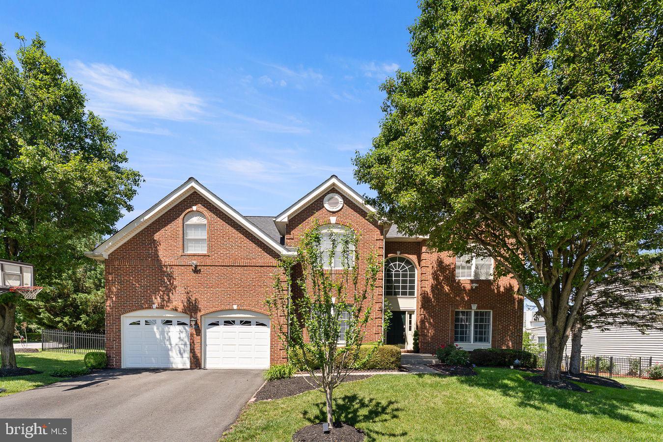 A harmony of classic design and contemporary finishes, this classic colonial home sits in the heart of Ashburn on a quiet, no–thru-traffic cul-de-sac, moments from Ashburn Metro where timeless architecture meets modern comfort in a light-filled residence. With 5,101 total square feet (approx. 4,825 finished) across three levels, the main floor welcomes with an inviting foyer, an open flow through sunlit living and dining spaces, and a spacious family room with fireplace. The gourmet kitchen features granite countertops, upgraded stainless steel appliances, abundant cabinetry, and island seating, opening to a bright breakfast area and an open deck, private patio, and landscaped yard, ideal for everyday living and effortless entertaining. All-level wood flooring enhances the cohesive, elevated feel, and the interior is freshly painted.
Upstairs, the serene primary suite includes a sitting area, a fully customized walk-in closet, and a spa-style bath with dual vanity, soaking tub, and separate shower. Secondary bedrooms are well sized and feature customized closets. The finished walk-up lower level elevates your lifestyle with a complete home theatre setup, a stylish wet bar, laminated wood flooring, a large recreation room, flex office/gym space, a full bath, and generous storage. The attached garage includes a 230V electric car charging point, plus driveway parking. Commuter-friendly and convenient, minutes to Ashburn Metro (Silver Line) with quick access to Dulles Greenway, Loudoun County Pkwy, and Route 50—close to Brambleton Town Center, Loudoun Station, parks, trails, shopping, and dining.
Update highlights: fresh interior paint; new stove and hood (2024); oven and microwave (2021); roof (2020); recently updated HVAC and water heater; whole-house humidifier; irrigation system; 230V electric car charging in the garage.