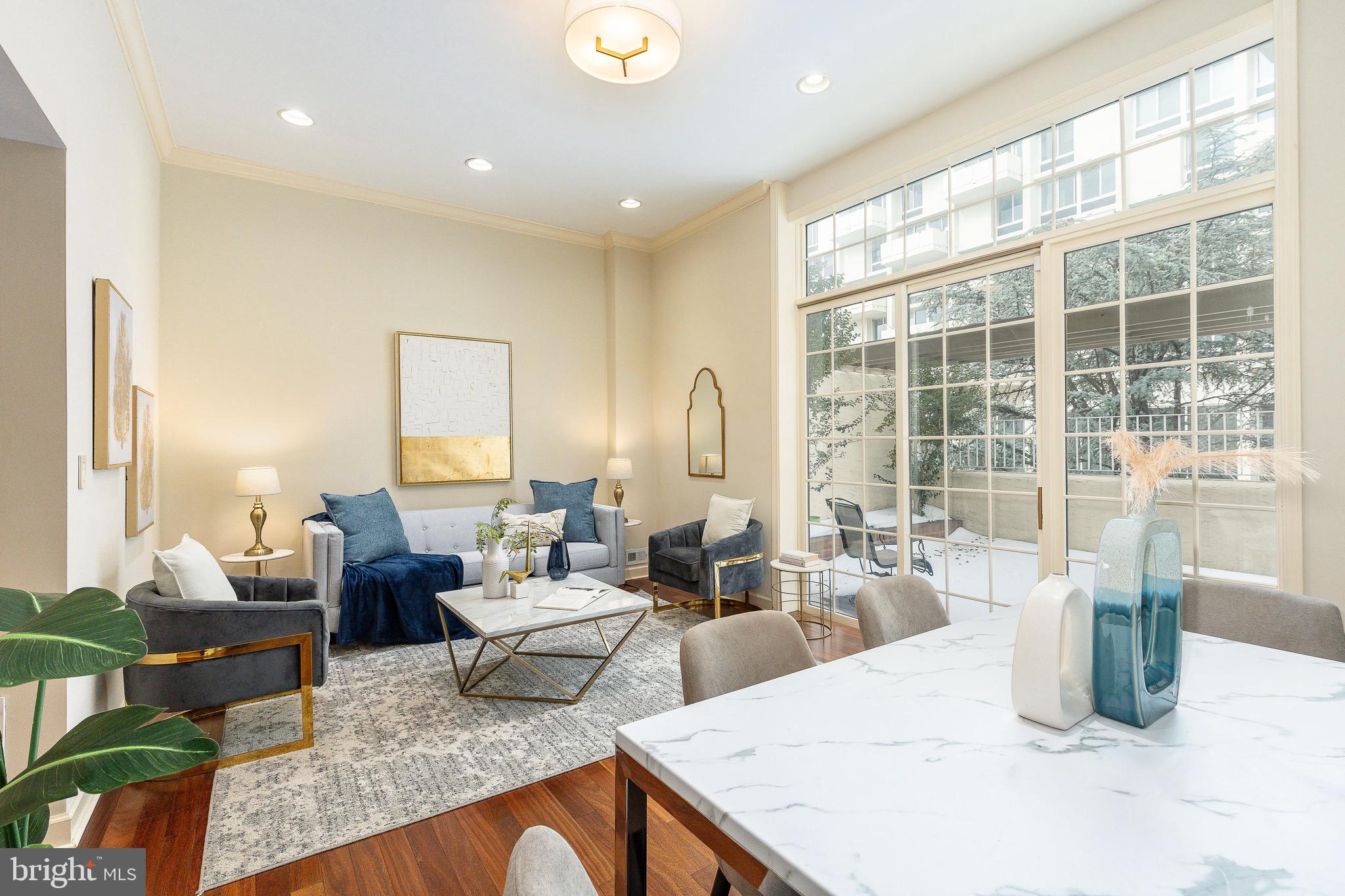Perfectly situated just steps from the historic beauty of Washington Square Park, 621 Spruce Street offers a rare combination of scale and location in the heart of Society Hill. This extra-wide, 19.5-foot townhome immediately impresses with a striking marble arched entry leading into a welcoming foyer with ample custom storage and an expansive gallery wall ready for your favorite art. The ground level provides the ultimate city convenience with a private, attached one-car garage and an additional dedicated parking space located directly behind it and a lower level with a full sized washer dryer.  Designed for both entertaining and daily comfort, the main floor features a renovated chef’s kitchen equipped with a large granite island and countertops, a Thermador range, and both recessed and under-cabinet lighting.  Bridging the kitchen and living area is a functional hallway featuring custom shelving and built-in wine storage leading to a perfectly placed powder room. The grand living room is a true showstopper, anchored by soaring ceilings and floor-to-ceiling glass window walls with a sliding door out to a large, private terrace. This outdoor retreat offers serene views of the historic Hopkinson House courtyard and sculptures, as well as the iconic Center City skyline.The upper levels host three spacious bedrooms, each featuring its own private en-suite bathroom for a true suite-style experience. The primary retreat is particularly impressive, boasting dramatic cathedral ceilings and picturesque views of the surrounding Society Hill neighborhood. Located within the coveted McCall School catchment, this property puts you in the center of Philadelphia’s premier dining and cultural scene, minutes from landmarks like Talula’s Daily, Zahav, and The Love. With its unique width, rare two-car parking, and sophisticated design, this home represents a premier opportunity for refined living in the city's most prestigious historic district.