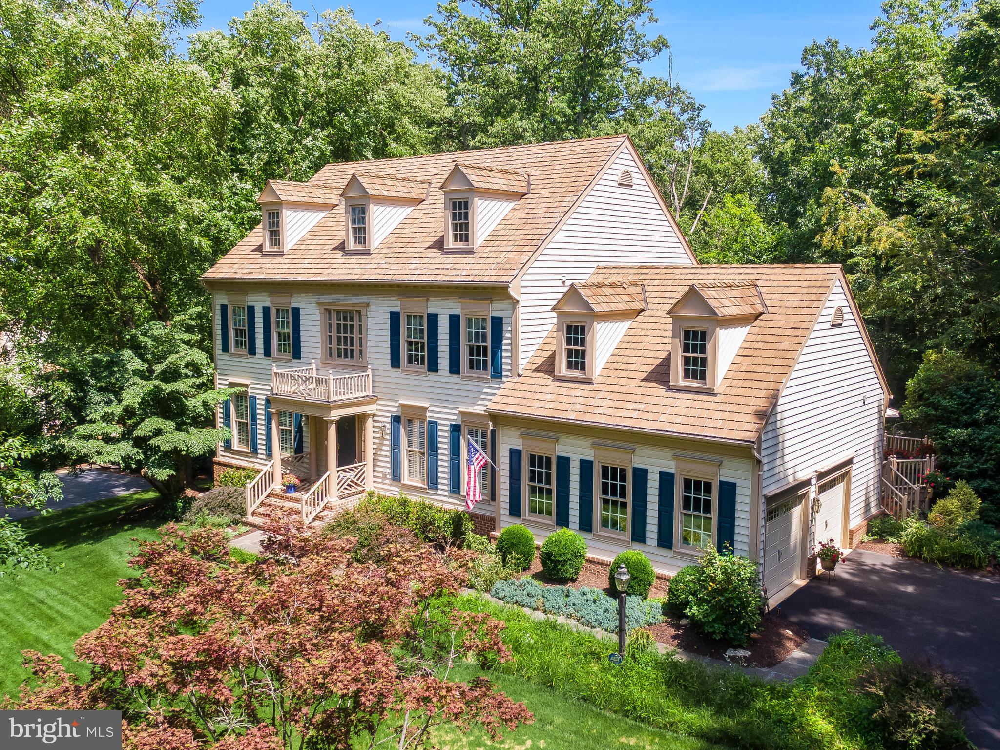 1195 Hawling Place offers one of the most compelling opportunities in Woodlea Hills — a spacious, well-maintained home with outstanding curb appeal, a private wooded setting, and access to one of Leesburg’s most established neighborhood lifestyles.

Set in the highly desirable Woodlea Hills community, the home offers many of the same lifestyle benefits associated with neighboring Woodlea Manor, including access to the pool, tennis courts, clubhouse, and neighborhood amenities, while providing the added advantages of larger lots, mature surroundings, and a greater sense of privacy. Woodlea Hills is known for its established setting, wooded feel, and homes that sit comfortably back from the street.

The home makes a strong first impression with mature landscaping, a welcoming portico, attractive exterior presentation, and a classic presence that fits beautifully within the neighborhood. Inside, the scale is immediately noticeable, with approximately 3,900 square feet above grade plus an additional 1,000 square feet of finished lower-level space, along with substantial unfinished and storage areas that provide flexibility for future expansion, hobbies, fitness, recreation, or workshop use.

The main level offers generous formal and informal living areas, a spacious kitchen, and comfortable gathering spaces designed for everyday living and entertaining. The family room is anchored by a beautiful stone fireplace with a gas insert, creating a warm focal point and a natural place to gather. Just beyond, the sunroom is one of the home’s standout features, offering peaceful views over the wooded rear lot and a true sense of connection to the private setting behind the home.

Outdoor living is equally appealing, with access to the deck, patio, and mature rear landscape. Whether enjoying morning coffee in the sunroom, relaxing by the fireplace, or spending time outside overlooking the trees, the home offers a calm, private backdrop that is increasingly difficult to find in such a convenient Leesburg location.

The home has been thoughtfully cared for over time, with notable improvements including kitchen updates, Andersen kitchen windows, updated systems, newer carpet, interior and exterior painting, recent landscaping, a Bosch dishwasher, water filtration, garage floor finish, deck staining, roof work, and major mechanical updates.

The upper level provides spacious bedroom accommodations, including a large primary suite with recent bedroom and bath improvements. The finished lower level adds valuable living space and gives the home the kind of flexibility buyers often need — whether for recreation, guests, work-from-home space, or future customization.

The location is another major strength. Woodlea Hills offers a quiet, established neighborhood setting while remaining close to historic downtown Leesburg, local restaurants, shops, parks, schools, and everyday conveniences. Commuters have convenient access to Route 15, Route 7, and the Dulles Greenway/Route 267, providing practical routes toward Dulles Airport, Tysons, Reston, and the broader Northern Virginia corridor.

For buyers who want the Woodlea lifestyle, substantial square footage, a more private wooded setting, and a home that has been well cared for over time, 1195 Hawling Place is a standout opportunity in one of Leesburg’s most desirable established neighborhoods.