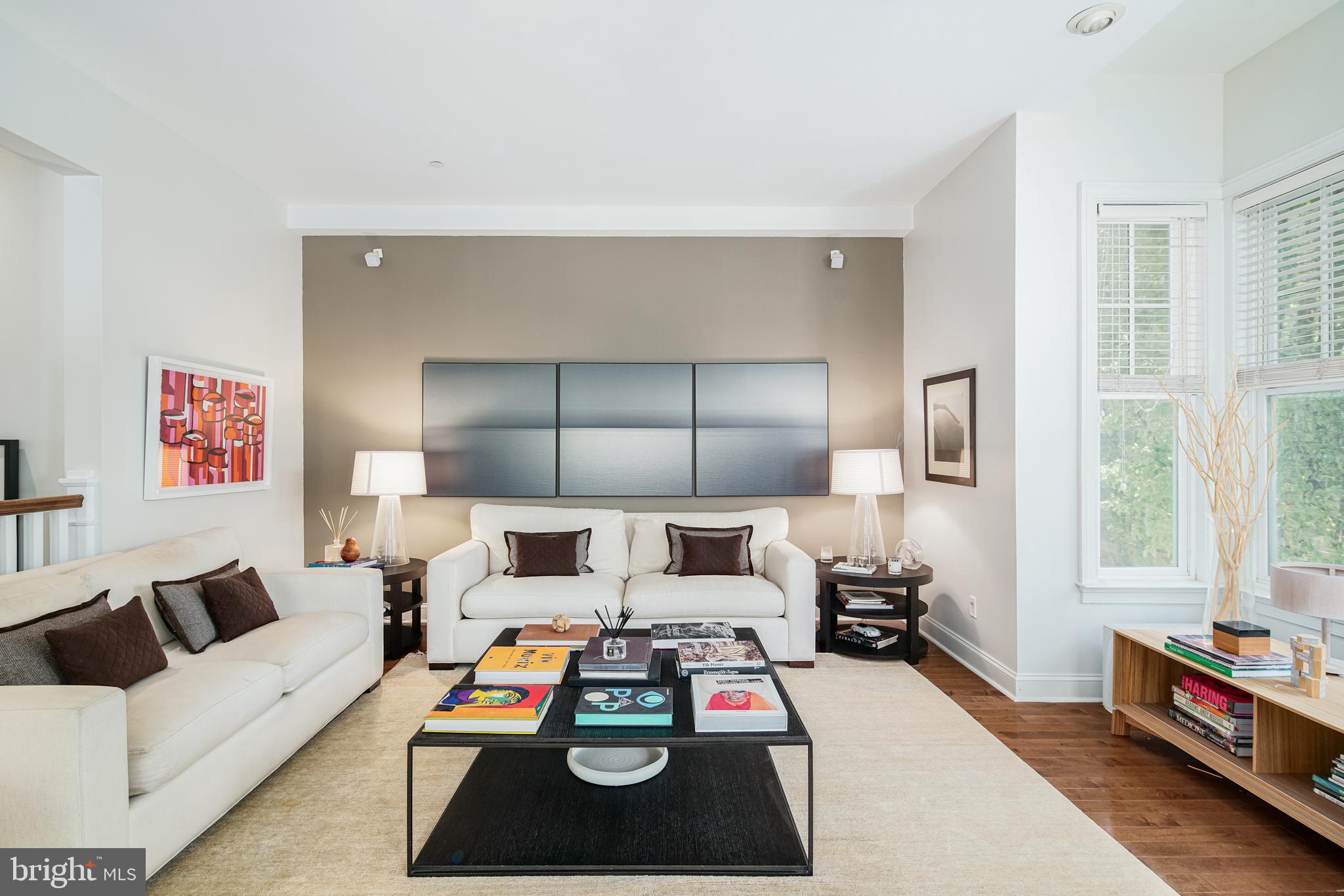Welcome to 235 Gaskill Street! This exquisite, unique 4-bedroom corner property exudes warmth, elegance, and comfort. Boasting an impressive living space designed by famous architect Dado Castello Branco, a 2-car garage, and an elevator, this sun-drenched home offers a seamless blend of modern amenities that meets a classic style. Step inside and be greeted by a formal entrance that leads to a spacious den room with a wall of built-in shelving, a lounging area, and sliding glass doors that open to the shaded backyard. The patio offers ample space for outdoor furniture, grilling, container gardening, and more. Head upstairs to the second floor and discover a bright and sunny living area with 10-foot ceilings, bay windows, and a fireplace.Hardwood floors and large windows flood the space with natural light throughout the entire property.  Adjacent is the open-concept chef’s kitchen, featuring custom cabinetry, Viking appliances, granite countertops, an island, and a formal dining area. This second-floor space is perfect for entertaining, complete with a half bathroom and a private balcony. The third floor houses the primary bedroom with large windows, huge custom walk-in closets, and an all-marble bathroom with double sinks, a glass shower, and a soaking jetted tub. This floor also includes an additional bedroom and a second full marble bathroom. Finally, make your way to the top floor to find 2 more bedrooms with a middle bathroom.  Each of these bedrooms features its own private balcony. The bigger bedroom has 2 built-in beds and a custom walk-in closet organizational system. Located in the highly desirable Society Hill, this home is tucked away on a tree-lined street in the prestigious Liberty Court, maintaining a quiet neighborhood feel while still offering all the convenience of city living. Take a short walk to the picturesque Washington Square Park or visit the charming 3 Bears Park, just a few blocks away. You're also only a 2 -minute walk from the Headhouse Square farmer’s market, which runs year-round! This exceptional location also boasts access to many restaurants, attractions, venues, shopping, and grocery stores! Plus, enjoy easy access to the Delaware River waterfront attractions and I-95 to get in and out of the city. Don't miss out on the opportunity to own this stunning property and live in one of the most coveted neighborhoods in Philadelphia. Schedule a tour today!