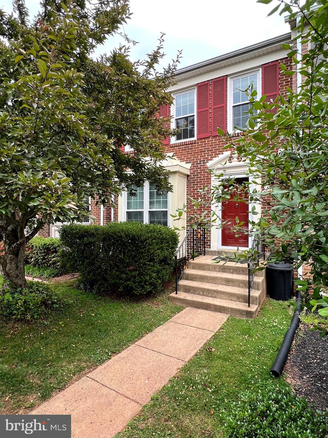Welcome to this very well maintained brick-front townhome offering a perfect blend of modern upgrades and timeless charm! Featuring a bright and open floor plan with gleaming hardwood floors throughout the main level, a renovated kitchen with granite countertops, stainless steel appliances, and elegant white cabinetry. Enjoy seamless indoor-outdoor living with access to a spacious deck overlooking lush greenery—ideal for relaxation or entertaining. Upstairs, you’ll find three generously sized bedrooms, including a stunning primary suite with vaulted ceilings and an en-suite bathroom. The fully finished walkout basement features a cozy fireplace, a large recreation area, a full bathroom, and access to a private fenced backyard—perfect for guests or additional living space.  Conveniently located near shopping, dining, and major commuter routes—this is the one you’ve been waiting for!