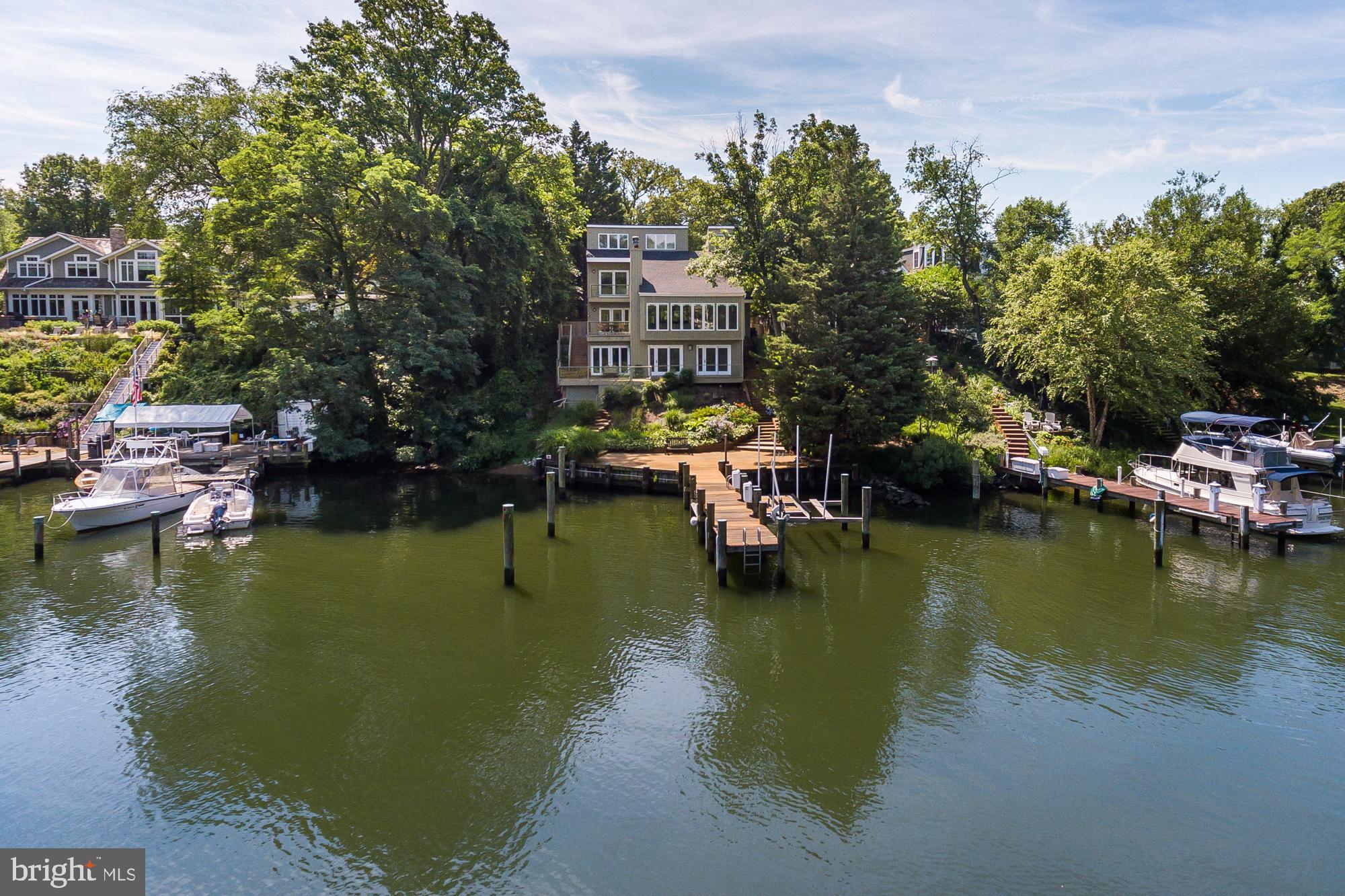 Enjoy a protected deepwater(6 ft) harbor for your sailboat and views of Spa Creek from this 4 BR contemporary home. Vaulted ceilings, skylights, most windows replaced, roof replaced in 2016. Deep water slip with lift, floating dock & multi level decks for outdoor living with extensive landscaping. Appraisers: House needed new siding and deck work. Kitchen and baths needed updating. Call list
