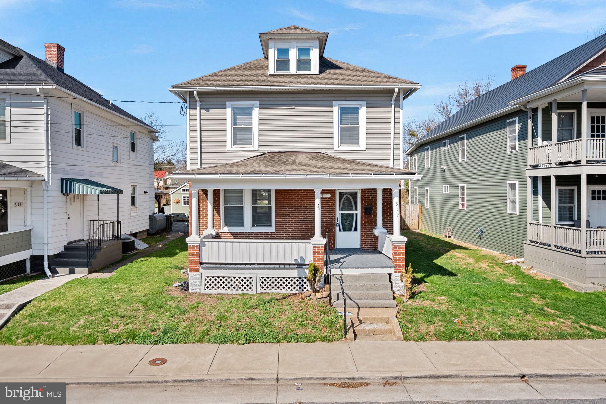 Welcome to 317 Gray Ave in Winchester, Virginia.

This charming Colonial blends historic character with extensive modern updates, creating the perfect balance of vintage appeal and contemporary comfort.

The home features 4 bedrooms, 2 full bathrooms, and 1 half bathroom, along with a recently finished attic that offers flexible additional living space. The primary suite includes a beautifully renovated private bathroom, while another bedroom features direct attic access, ideal for a home office, creative space, or extra storage. One of the bedrooms also offers balcony access overlooking the spacious backyard, adding unique charm to the home.

While the property maintains its original hardwood floors and classic character, it has undergone significant improvements, including:

• Fully renovated kitchen with quartz countertops, new cabinetry, stainless steel appliances, and backsplash
• Upgraded bathrooms, including a new half bath and renovated primary bathroom
• Fresh paint throughout
• New roof 2025
• Two HVAC systems, One Brand New 2026 and the second HVAC (2023) with zoned heating and cooling.

The exterior offers a large fenced backyard with new wire fencing, providing privacy, functionality, and additional convenience.  0.17-acre lot (7,423 sq ft) Long 190-ft deep lot with ALLEY ACCESS. 

Located just minutes from downtown Winchester, this home offers easy access to shopping, dining, parks, and commuter routes.

This property is truly move-in ready and presents a rare opportunity to own a historic home thoughtfully updated with today’s essential upgrades.