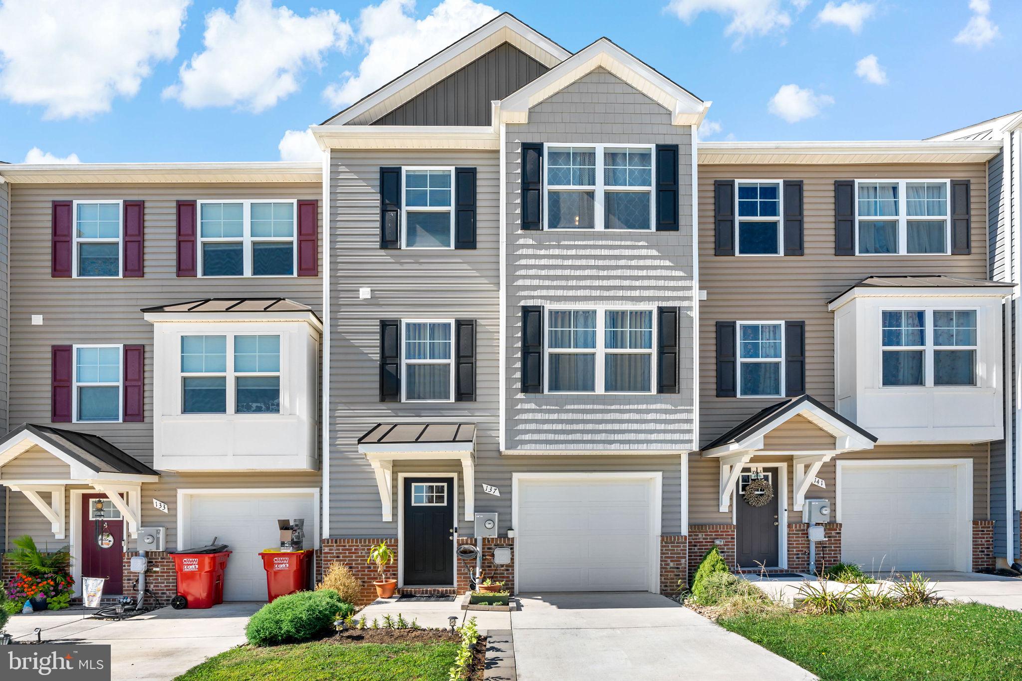 This modern townhome in the Communities of Burwell is sure to wow! Walk in on the basement level complete with  a bedroom and a full bath, perfect for a guest room, full office, or however you see fit! The main level features a gorgeous kitchen with upgraded cabinets and countertops and a spacious open concept, perfect for relaxing and entertaining. Upstairs you'll find 3 bedrooms and 2 more full baths, including the owner's suite with walk-in closet, double vanity, and tile shower. Just built in 2021, this home still shows like new and is move-in ready!