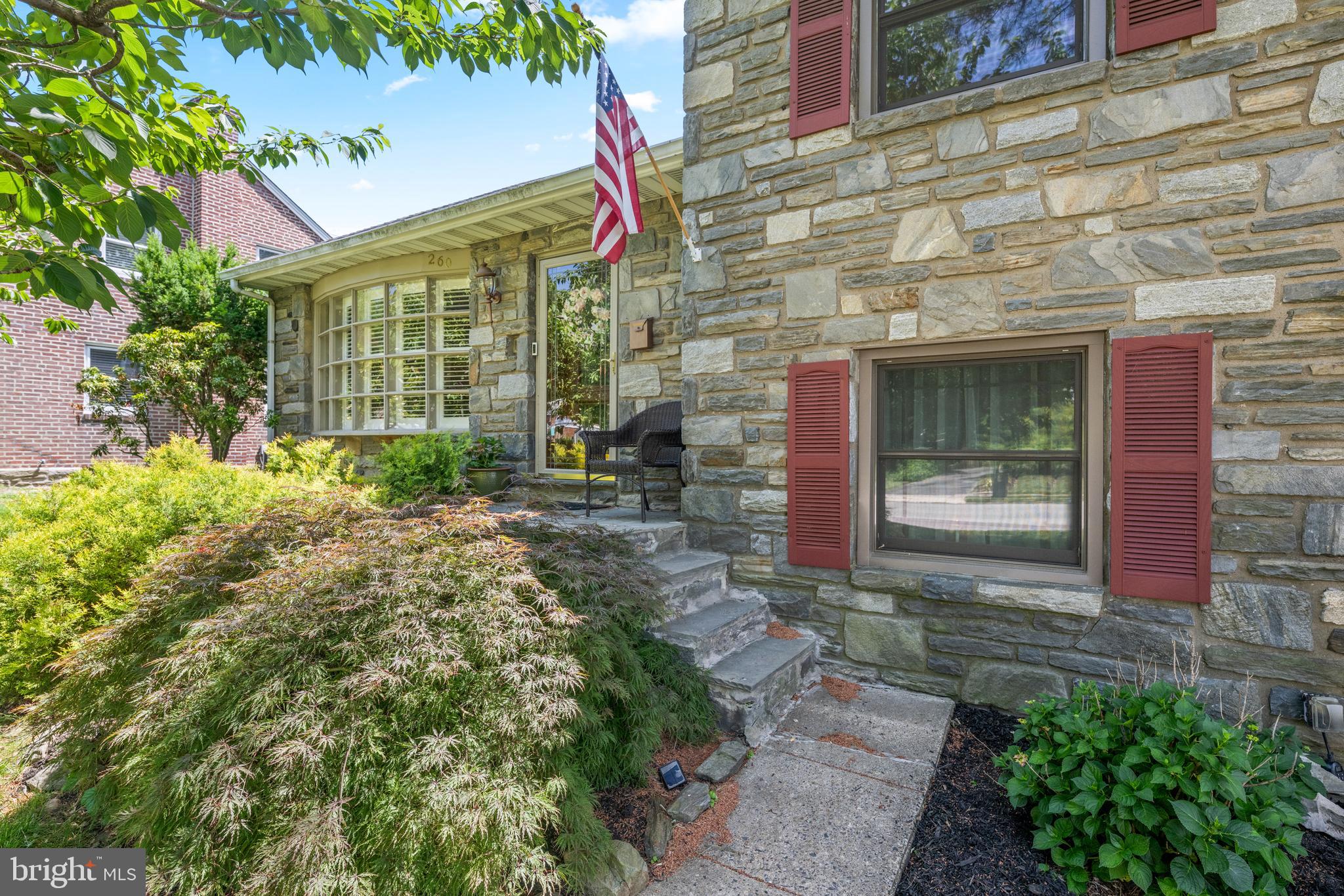 Welcome to this custom-built four-bedroom, two-and-a-half-bath home offering five levels of thoughtfully designed living space in one of Springfield's most sought-after neighborhoods. Set on a beautifully landscaped corner lot, this unique home combines generous living areas, architectural character, and an unbeatable location. Step inside to a spacious living room highlighted by gleaming hardwood floors and a large bay window that fills the space with natural light. The adjoining formal dining room features a picturesque window overlooking the backyard, creating the perfect setting for everyday meals and special gatherings. The eat-in kitchen offers classic white cabinetry and ample space for casual dining. The second level features a private primary suite with an en-suite bath and stall shower, along with two additional generously sized bedrooms that share a beautifully updated hall bath with a vaulted ceiling. The top level provides a versatile oversized fourth bedroom, ideal as a guest suite, home office, or bonus living space. The inviting lower-level family room is the heart of the home, featuring radiant heated floors, a stunning stone fireplace, and direct access to the backyard patios and outdoor entertaining areas. A convenient powder room connects to the attached garage. The finished basement adds even more flexible living space, perfect for a recreation room, home office, gym, or playroom, while also offering abundant storage, laundry facilities, and utility space. Outside, multiple patios and mature specimen trees create a private outdoor retreat. Located on a quiet street just one block to the Springfield  Library and park, this special home offers the perfect blend of space, comfort, and convenience.