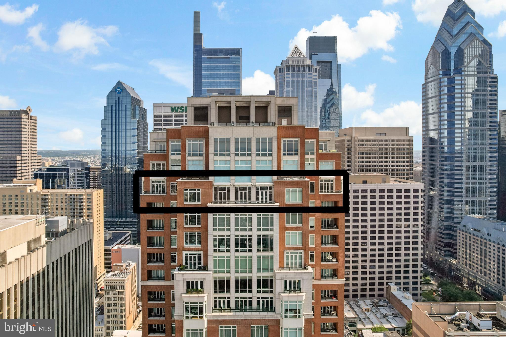 Welcome to Unit 3102 at 10 Rittenhouse, an extraordinary nearly full-floor residence offering approximately 5,400 square feet of refined, light-filled living space high above Rittenhouse Square. This home delivers the scale and comfort of a modern townhome, elevated by the white-glove amenities and prestige of one of Philadelphia’s most iconic buildings.

An incredibly rare offering, the unit includes two of the ultra-coveted self-park licenses located within the building’s garage, providing flexibility and convenience that is nearly impossible to find in Center City.

Inside, the residence opens to sweeping 270-degree skyline views centered on Rittenhouse Square, visible through floor-to-ceiling glass double doors and three separate balconies. Natural light fills every room, creating a sense of openness and calm that is matched by the clean, contemporary design throughout. The main living and entertaining areas are expansive and welcoming, anchored by a custom-built wall unit that houses a 100" television and includes a hidden door accessing the AV closet. It is complemented by a beautifully designed bar equipped with a wine fridge, ice maker, sink, and a truly massive walk-in pantry that functions as a secondary prep space or staging area for entertaining.

The dining area is perfectly positioned just off the kitchen, facing southwest, where you’ll enjoy open, unobstructed corner-window views that stretch toward the skyline and flood the space with golden afternoon light. The flow from kitchen to dining to living is effortless and designed for both large-scale entertaining and intimate daily living.

The primary suite is a retreat all its own—thoughtfully laid out and filled with soft natural light. It features three dedicated closets, including two walk-ins and a spectacular L-shaped dressing closet with an east-facing window. The spa-style bathroom includes a separate water closet, a jetted soaking tub with an east-facing window and wall-mounted TV for cozy baths, and two separate vanities. Just beyond the dressing room is a third vanity, ideal for makeup or grooming. The enormous walk-in closet, fully customized by California Closets, feels worthy of a magazine feature. Past the dressing room, a tranquil home office space offers complete privacy, ideal for focused work or quiet reflection, and opens to its own east-facing balcony with morning light and city views.

Two additional bedroom suites are located off a den on the west side of the home. Each includes an en-suite bathroom and generous closets, offering flexibility for guests, family, or remote work setups. There are two separate laundry areas—one tucked discreetly into the primary suite and another off the kitchen—adding function and convenience to daily living. The entire residence is equipped with a range of powered sunshades, blackout shades, and draperies, and features a fully customized Lutron lighting system. More than a dozen zoned climate controls ensure year-round comfort, room by room.

Living at 10 Rittenhouse includes access to five-star amenities and services, including 24/7 concierge, a state-of-the-art fitness center, indoor pool, hospitality suite, chauffeur-driven house vehicle, and more. The building's discreet entrance on 18th Street places you just steps from the city’s best dining, shopping, and cultural institutions.

This is a rare opportunity to own one of the most spacious, private, and refined residences in the city—designed for those who value scale, light, and luxury at the highest level.
