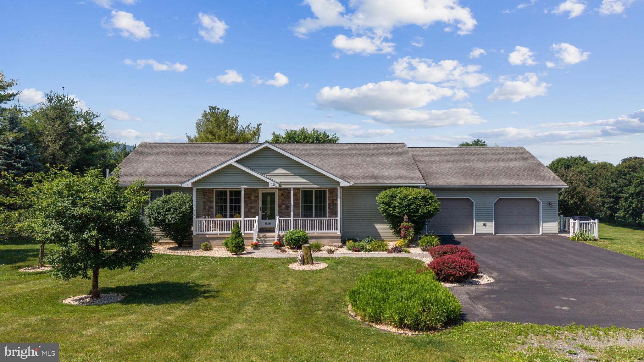 Welcome to 121 Maple Lane, a beautifully maintained True Ranch home offering 3 bedrooms, 2.5 bathrooms, and a thoughtfully designed living space on a picturesque 0.87-acre lot, where the gentle rustle of leaves and the scent of fresh greenery create an immediate sense of calm. Nestled in a serene setting, surrounded by soft birdsong and sweeping views of lush landscape, while remaining just minutes from Penn State University, Beaver Stadium, and downtown historic Bellefonte. Inside, you’ll find lovely accents, new luxury vinyl plank throughout and a beautifully updated kitchen that serves as the heart of the home, where warm finishes and inviting textures make every meal feel special. The spacious, heated & cooled sunroom is a standout feature, showcasing walls of windows that bathe the space in golden natural light and frames tranquil views of the lush greenery, creating a peaceful place to unwind. The convenient ranch-style layout includes all primary living spaces and laundry on the main floor, while the unfinished lower level presents excellent potential for future expansion. Luxury meets comfort with radiant floor heating installed across both the main floor and the basement. Outside, the meticulously landscaped grounds create an inviting setting for relaxation and outdoor enjoyment, with vibrant plantings, soft grass underfoot, and open skies overhead. Additional features include a two-car attached garage, a separate integral lower-level garage, and an impressive 18’ x 21’ storage shed providing ample space for hobbies, equipment, or additional storage.  Offering a combination of privacy, convenience, and exceptional care, 121 Maple Lane presents an outstanding opportunity to enjoy comfortable living in one of Centre County’s desirable locations, where every day feels like a quiet escape.