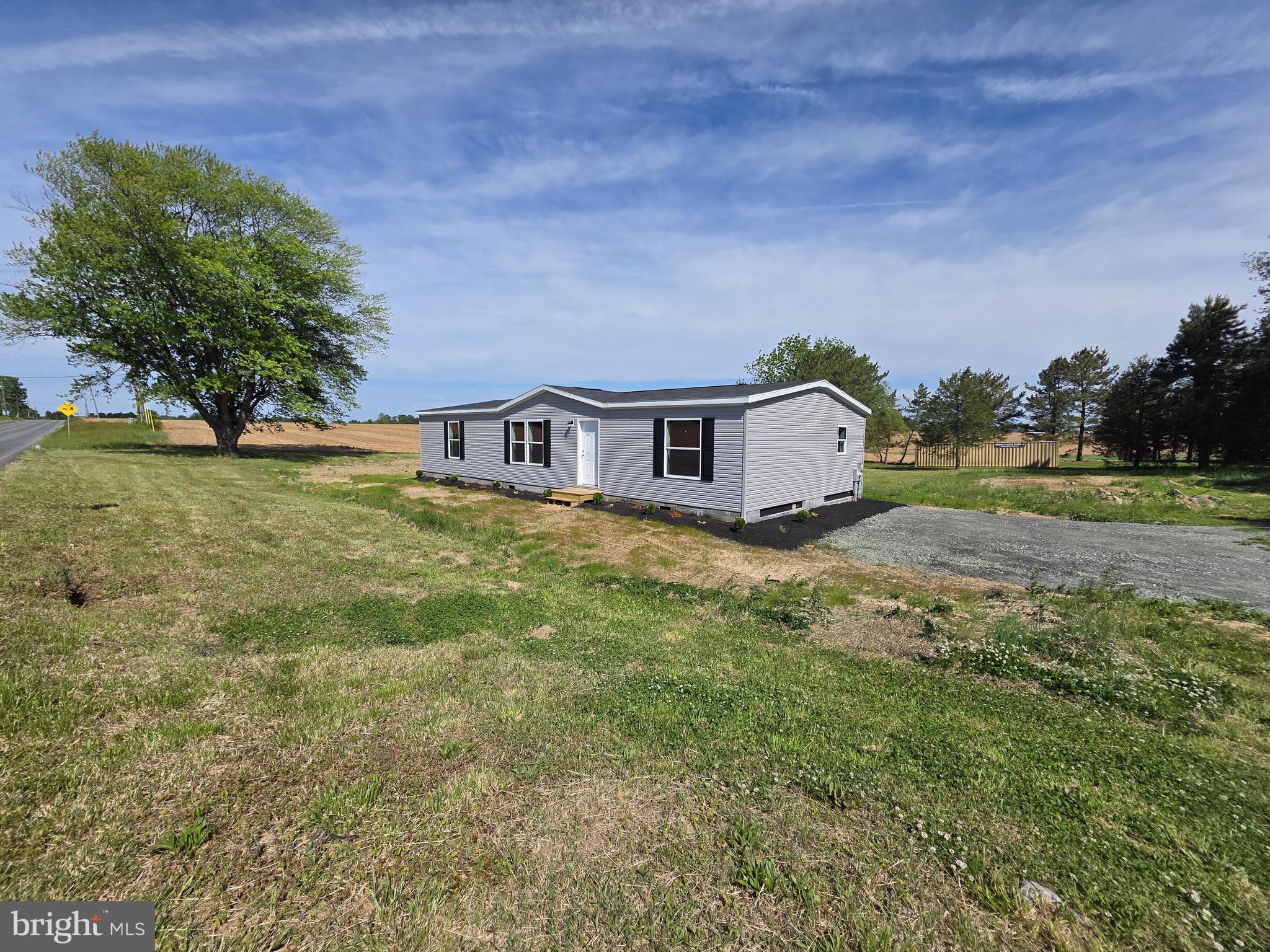 Brand New Champion Homes, Double Wide on a gorgeous 3/4 acre lot.  3 bedrooms, 2 full baths, over 1500/SF of living space! Well and septic inspected and up to code. Bright, open and beautifully designed. This is a rare opportunity to enjoy a brand new home on a gorgeous lot.  Rural setting but just minutes away from every desired amenity.  Schedule a tour and make this beauty yours today!