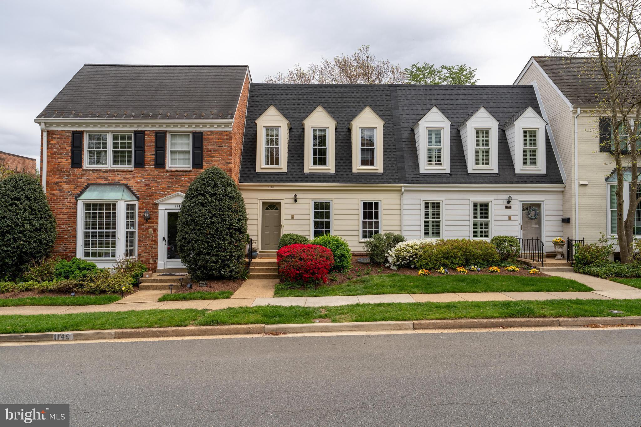 Updates galore! This townhome in sought after Kings Manor is a stunner! Prepare to be wowed by the beautiful kitchen remodeled in 2023 with high quality soft close custom cabinetry, instant hot water & filtered water on tap, a Wolf induction range & microwave, Thermador fridge, range vent & under counter wine fridge. As you enter there is a separate dining room on your right with gorgeous custom drapery and designer chandelier. On the left is a tastefully renovated powder room. Walk down the hallway to the spacious family room area with a wall of beautiful custom built-in bookcases that anchor the room and allow for plenty of storage and showcasing. Flanking the fireplace you will also find custom built-ins. Head up stairs to 3 bedrooms, all with hardwood flooring and ample closets. The upper level bathrooms feature updated vanities and mirrors. The lower level has been completely updated and boasts new LVP flooring, a 4th bedroom, new stair railings and hardwoods on stairs, renovated basement bathroom, new basement sliding door to rear flagstone patio and added built-in. Relax and entertain at the rear oasis that has been thoughtfully landscaped by Land Art. Use the rear gate to access additional parking on the street behind the home. 
Enjoy energy efficient heating and cooling with a new heat pump (2022), and new backup electric furnace (2023); new electric water heater with it's own heat pump (2022); and new attic insulation!  You will also enjoy the benefit of a whole house water filter and newer roof (2021). Easy commuter access to Rt.123, GW Parkway, 66, 495, and the Silver Line Metro. There is plenty of on-street parking available, sidewalks throughout and community grounds for you to enjoy. This impeccably maintained and updated home is a true gem in a fabulous location!