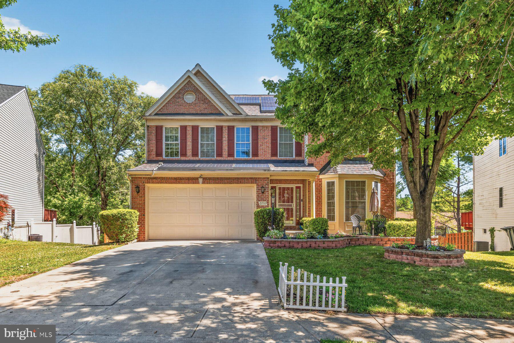 Welcome to 3710 Green Oak Ct—a beautifully maintained brick-front Colonial tucked away on a quiet cul-de-sac in one of Parkville's most desirable neighborhoods. Built in 2001, this spacious home offers approximately 2,668 square feet of living space with 6 bedrooms and 3.5 bathrooms, blending generous living areas with exceptional indoor-outdoor entertaining.

Step inside to find a bright, welcoming foyer flanked by formal living and dining rooms featuring gleaming hardwood floors, oversized windows, and elegant moldings. The heart of the home is the expansive eat-in kitchen, complete with abundant cabinetry, granite-look countertops, a center island, stainless steel appliances, and a convenient workstation—perfect for everyday living or hosting family and friends.

The adjoining family room offers a cozy fireplace and direct access to the incredible outdoor living space. Enjoy morning coffee or summer gatherings on the oversized rear deck overlooking mature trees, then head down to the covered patio and custom paver seating area for year-round entertaining. The fenced backyard provides privacy, shade, and plenty of room to play.

Upstairs, the spacious bedrooms offer flexibility for family, guests, or home office space, while the thoughtfully designed layout provides comfort and functionality throughout.

Additional highlights include:

Attractive brick-front exterior with charming covered front porch
Two-car attached garage and spacious driveway
Solar panels for added energy efficiency
Hardwood flooring throughout formal living areas
Large deck with gazebo plus covered patio below
Mature landscaping and beautifully maintained yard
Quiet cul-de-sac location with easy access to shopping, dining, commuter routes, and local parks

If you're looking for space, privacy, and exceptional outdoor living in Baltimore County, 3710 Green Oak Ct is ready to welcome you home.