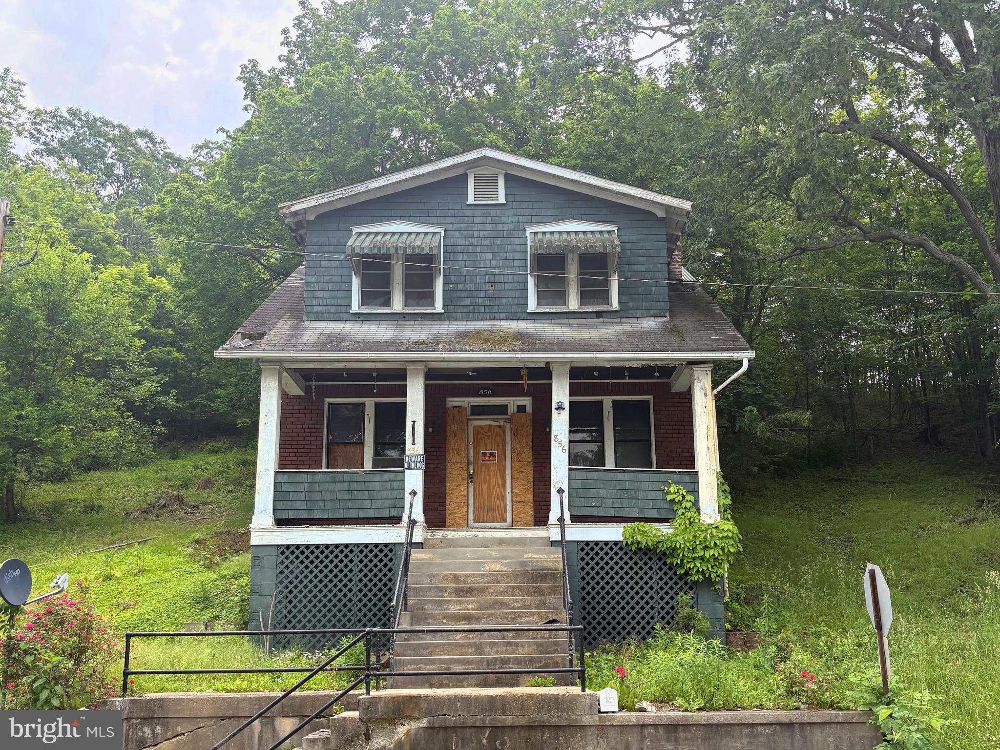 ***BRING OFFERS. CURRENTLY LISTED UNDER TAX ASSESSED VALUE*** AS-IS. House needs a significant amount of work. Will not qualify for FHA/VA in current condition. Large rooms, original 1920s period pine flooring on upper level, fireplace.  With sweat equity and time you could turn this into something nice at a price that can't be matched for a craftsman style home of this size.  Bank owned.