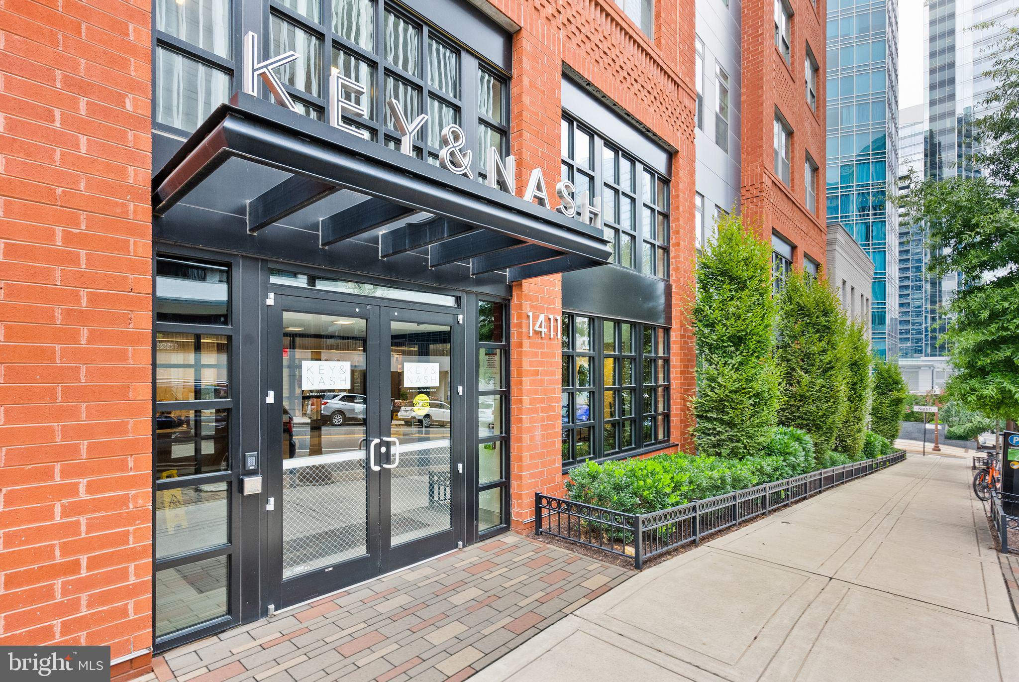 This luxury boutique building in Rosslyn is an incredible place to live! The building is located in Rosslyn, a desirable neighborhood known for its proximity to Georgetown/Washington, DC and easy access to public transportation. Being just 2 blocks away from the Metro station makes commuting and exploring the city very convenient.  This unit is a penthouse, offering scenery of the city and a sense of sophistication includes a balcony, where residents can enjoy outdoor space and fresh air while taking in the surrounding cityscape.  The spacious design boasts 9'+ ceilings, creating an open and airy atmosphere. Expansive windows not only allow plenty of natural light to flood the space but also enhance the panoramic views.  Hardwood flooring throughout the unit adds a touch of elegance and sophistication to the living space.  The kitchen is equipped with stainless steel Electrolux and Bosch appliances, known for their reliability and sleek design.  It also features quartz countertops, which are both durable and visually appealing. Custom cabinetry provides ample storage space and adds a touch of luxury to the cooking area. All baths are designed with high-end materials and fixtures, providing a sense of luxury and comfort.  The primary bath has a spacious and well-appointed shower, offering a relaxing and indulgent experience. Primary bedroom includes custom walk-in closet, providing ample space for storing and organizing clothing, accessories, and personal belongings.  The building offers a range of services to enhance residents' lifestyles. Front desk concierge service ensures convenience and security, making it easier to receive packages and greet guests.  The building provides several amenities to promote a comfortable and enjoyable living experience. This includes a rooftop terrace on the 6th floor, allowing residents to relax and socialize. A state-of-the-art fitness center ensures residents can maintain an active lifestyle. The resident lounge and billiards room offer spaces to socialize and unwind.  For those who enjoy cycling, the dedicated bike room offers a safe and convenient place to store bicycles.  The availability of one garage parking space ensures residents have a secure and sheltered area to park their vehicles.  This luxury boutique building offers an upscale living experience with its thoughtful design, modern amenities, and convenient location near public transportation.