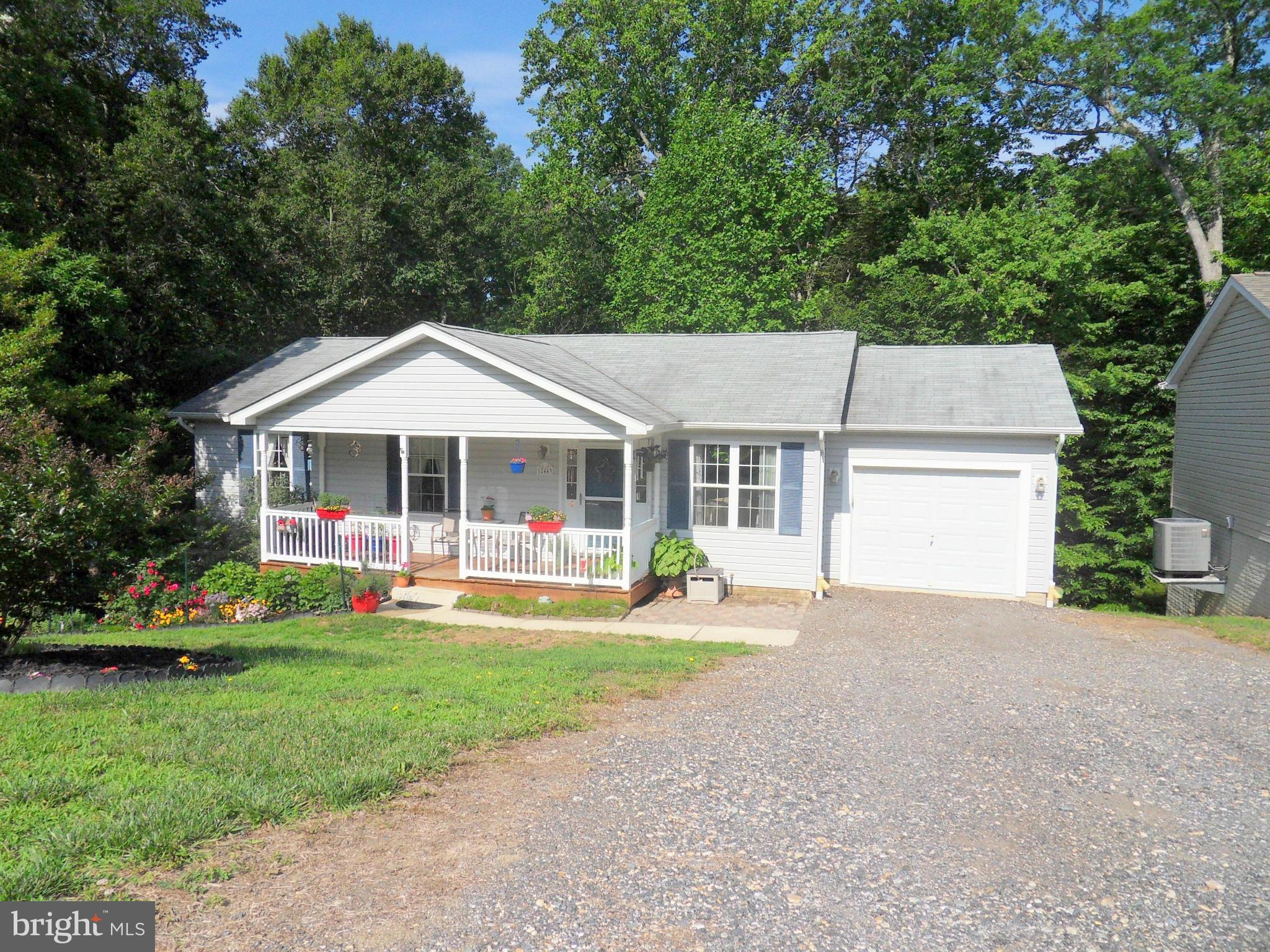 What a GEM! 3 BR and 2 Full Bath.  Kitchen-Living Room combo with vaulted ceilings. Living room pre wired for surround sound. Unfinished basement with rough in basement....finish the way you want!! Beautiful landscaping. Community beach. Close to shopping, dining and more!