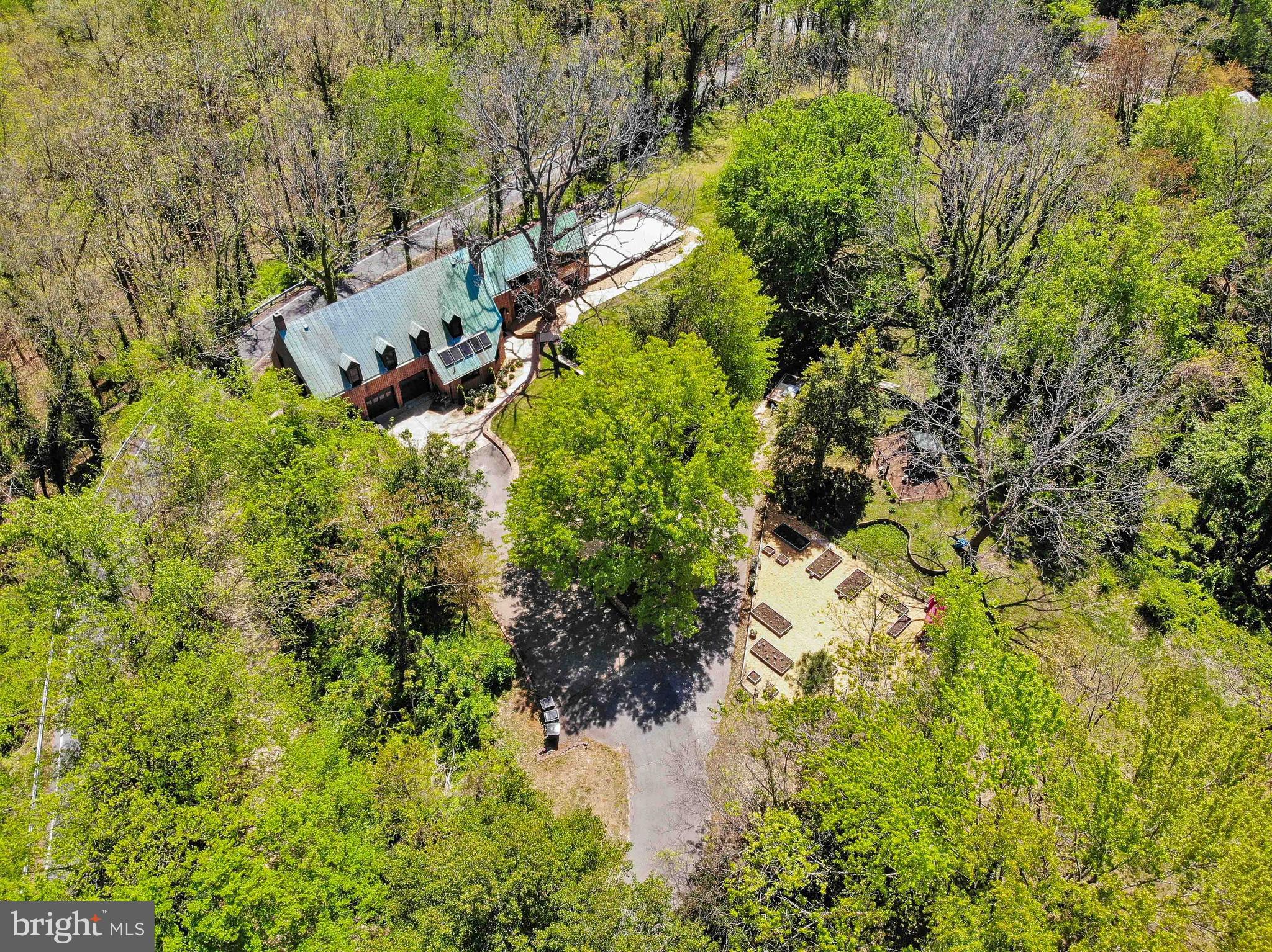 A truly rare opportunity to own one of the area's most distinctive estates. Situated on approximately 3 private acres, this remarkable Tidewater Vernacular Revival residence offers nearly 6,000 square feet of living space with 7 bedrooms, 6 full bathrooms, and 1 half bath, delivering an unmatched combination of historic character, modern comfort, exceptional craftsmanship, and income-producing potential.
Currently operated as a successful multi-unit Airbnb with three private guest suites and a separate main residence, the property provides incredible flexibility for a variety of lifestyles and investment goals. Continue operating as a short-term rental, create a multigenerational compound, enjoy a primary residence with supplemental rental income, or utilize as a single grand estate.
Steeped in local history, the home's exact age remains unknown after county records were lost in a courthouse fire, but local historians believe it may have been built by John Bancroft. Expert brick masons have noted that the home's distinctive brickwork predates 1900. Built to an extraordinary standard rarely seen today, the structure features over 20-inch-thick brick walls, concrete-supported floors reinforced by riveted steel beams, and a legendary 100-year copper roof. The result is a residence that feels more like a fortress than a traditional home.
Since purchasing the property in 2018, the current owners have invested extensively in updating, improving, and maintaining the home while preserving its historic integrity and architectural significance. The result is a property that seamlessly blends timeless craftsmanship with the conveniences expected by today's homeowners and guests.
The expansive main kitchen is designed for both everyday living and entertaining, featuring a Thermador six-burner gas range with integrated grill, farmhouse sink, bar sink, abundant workspace, and generous storage.
The owner's suite is a private retreat featuring a wood-burning fireplace and a secure three-point locking exterior door that opens to an industrial-style metal exit staircase. A second wood-burning stove adds warmth and character to the lower level.
The property offers an abundance of unique amenities seldom found in a single residence, including a secured concrete panic room with steel door, lock guards, and keypad access; a whole-house alarm system with independent controls for each living area; app-based monitoring capabilities; and exterior camera systems covering the garage and rear grounds.
Storage is exceptional throughout. A massive fully floored attic spans nearly the entire upper level and breezeway, providing an enormous amount of easily accessible storage space. The two-car garage includes built-in shelving, while the home's versatile layout accommodates everything from a home gym to hobby spaces and work-from-home needs.
Natural light floods the upper and lower breezeways, where walls of windows frame beautiful views and create inviting transitional spaces. Outside, landscaped stone pathways meander throughout the grounds, leading to a fenced garden area, a fully functional chicken coop, and numerous opportunities for expansion. With ample acreage available, there is room to add a pool, detached workshop, guest cottages, recreational amenities, or additional outdoor living spaces. Boating enthusiasts will appreciate the property's proximity to a local marina just minutes away, offering deep-water slips and convenient access for spending unforgettable days cruising, fishing, and exploring the river.
Properties offering this level of history, versatility, privacy, security, and income potential are exceptionally difficult to find. Whether you're seeking a landmark residence, a multigenerational family compound, a hospitality investment, or a combination of all three, this one-of-a-kind estate presents an opportunity unlike any other. Please no driveby's as there are guests at times.